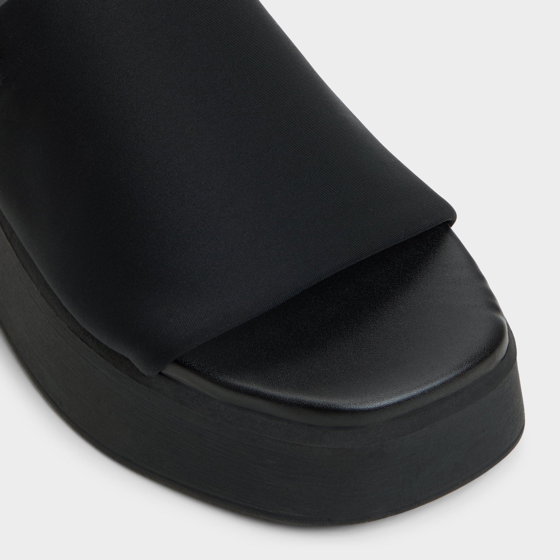 Close-up of the Black Yassa Wedge sandal