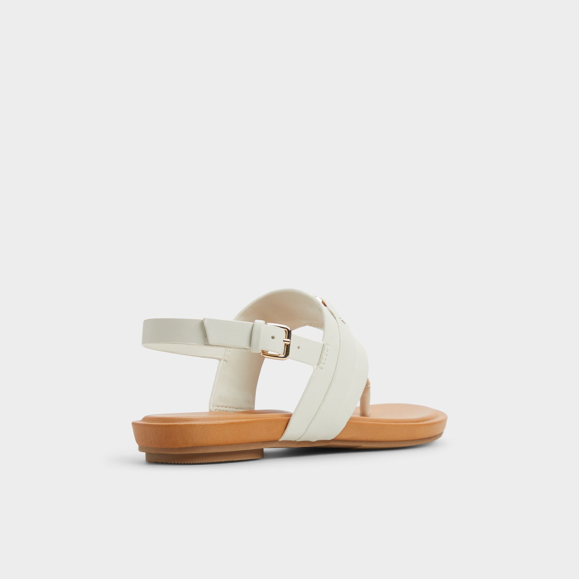 Three-quarter angle of White/Bone Taylen T-strap sandal's back side