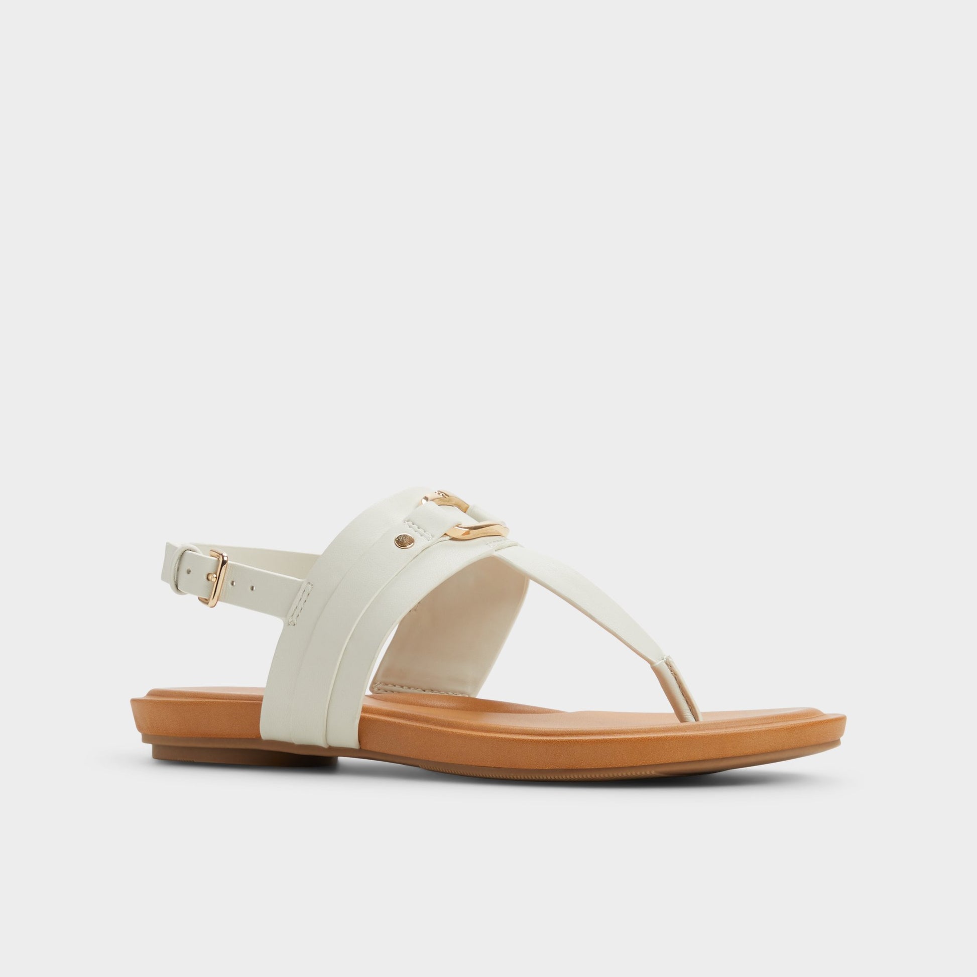 Three-quarter angle of White/Bone Taylen T-strap sandal's front side
