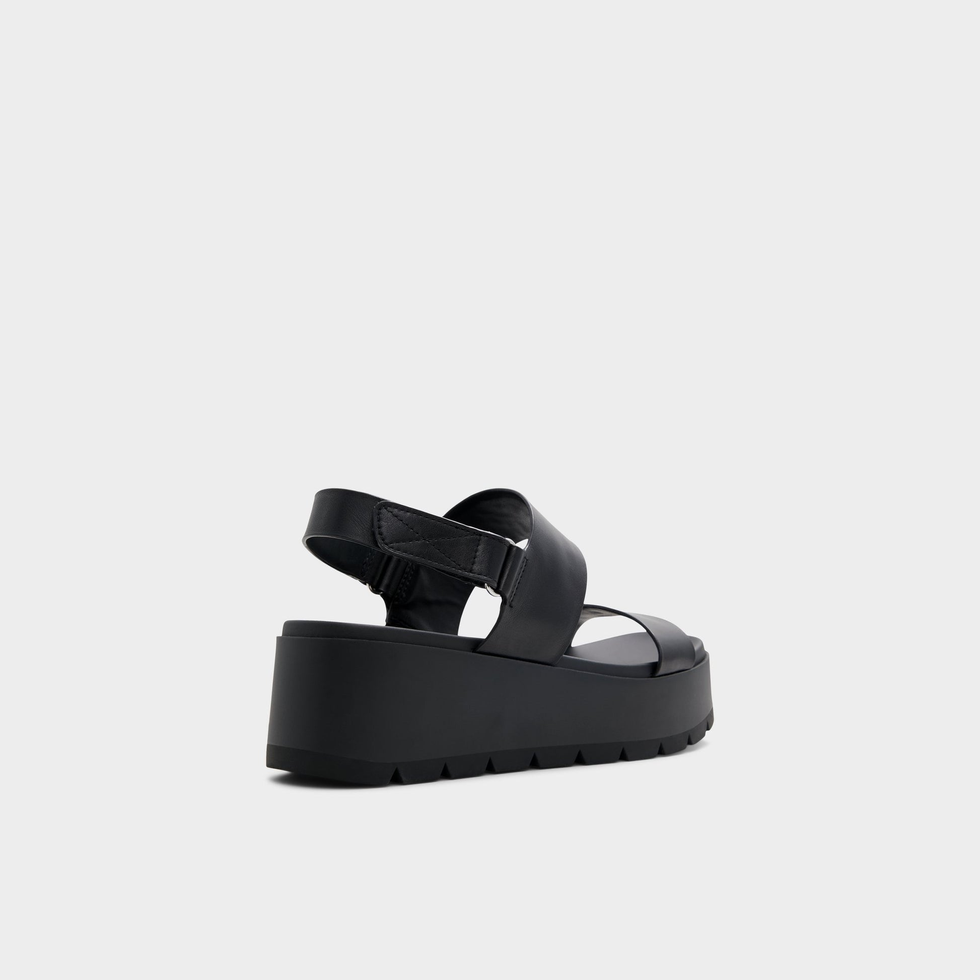 Three-quarter angle of Open Black Thila Wedge sandal's back side