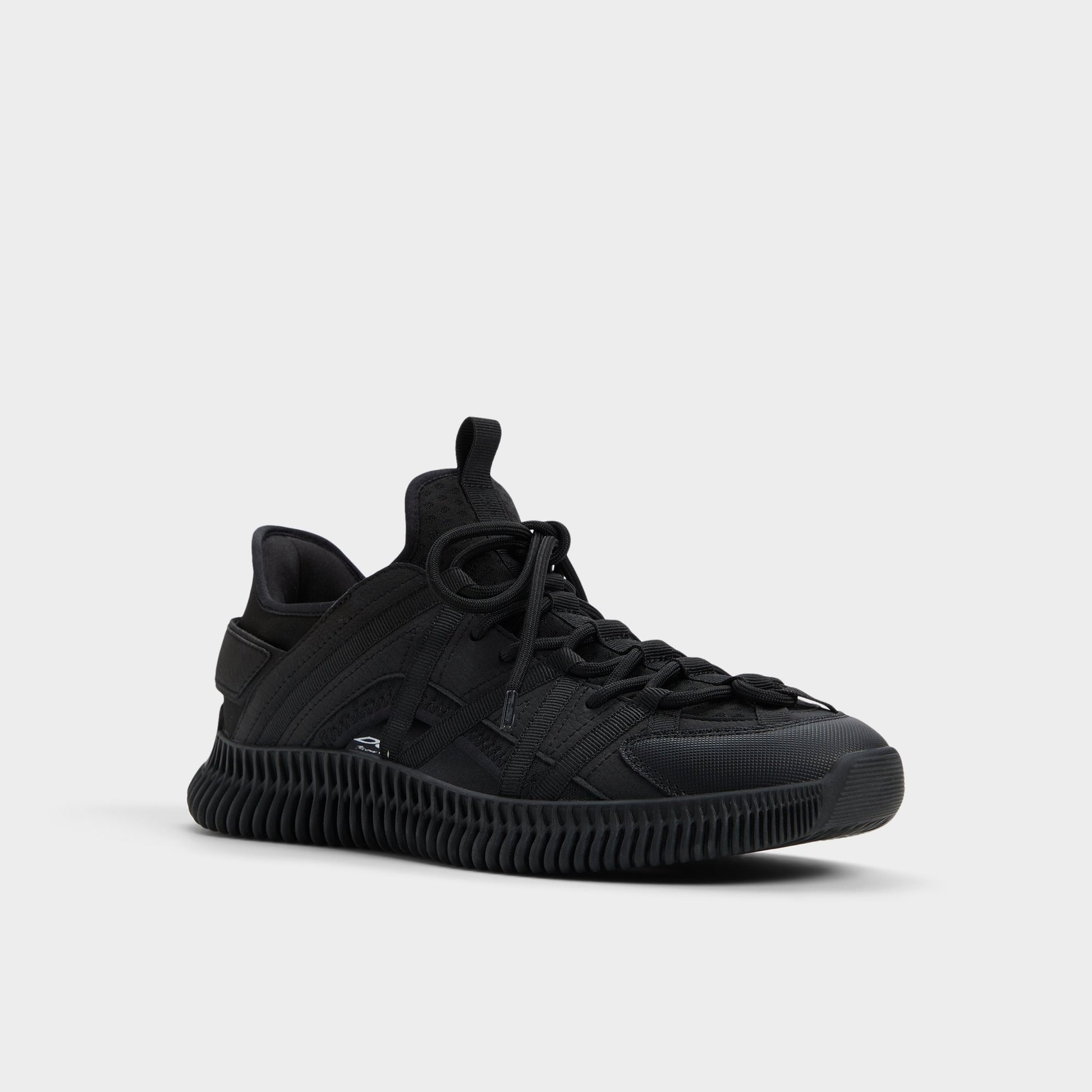 Three-quarter angle of Black Cael Slip-on sneaker's front side
