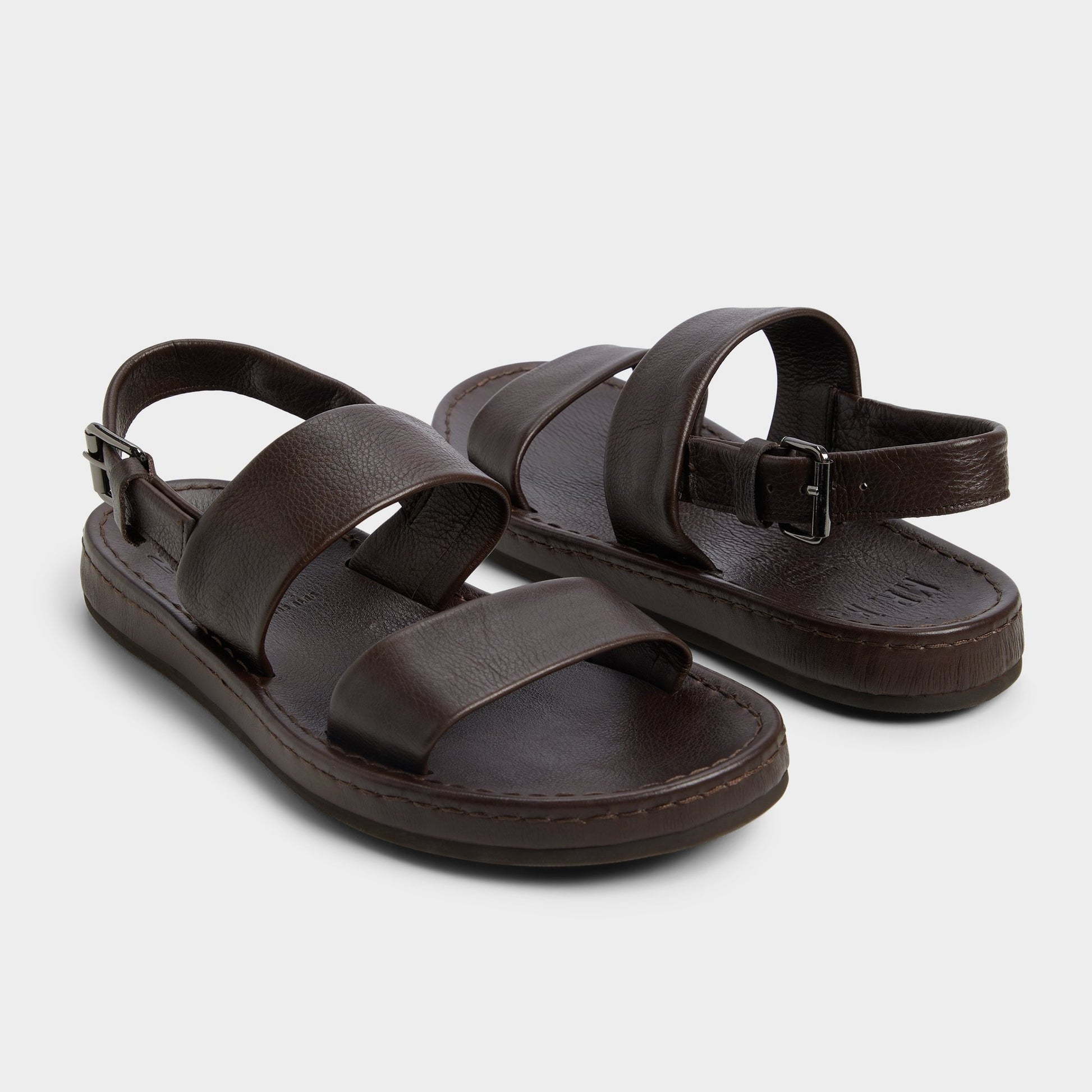 Highlighted view of a pair of Dark Brown Wiley Slide sandals