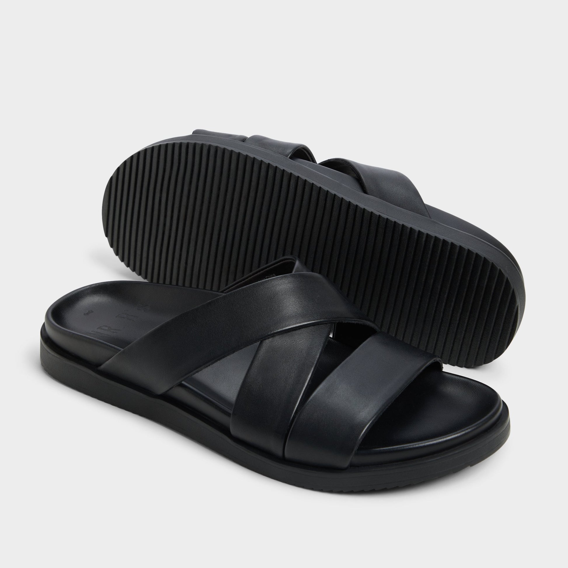 Highlighted view of a pair of Black Kairo Slide sandals
