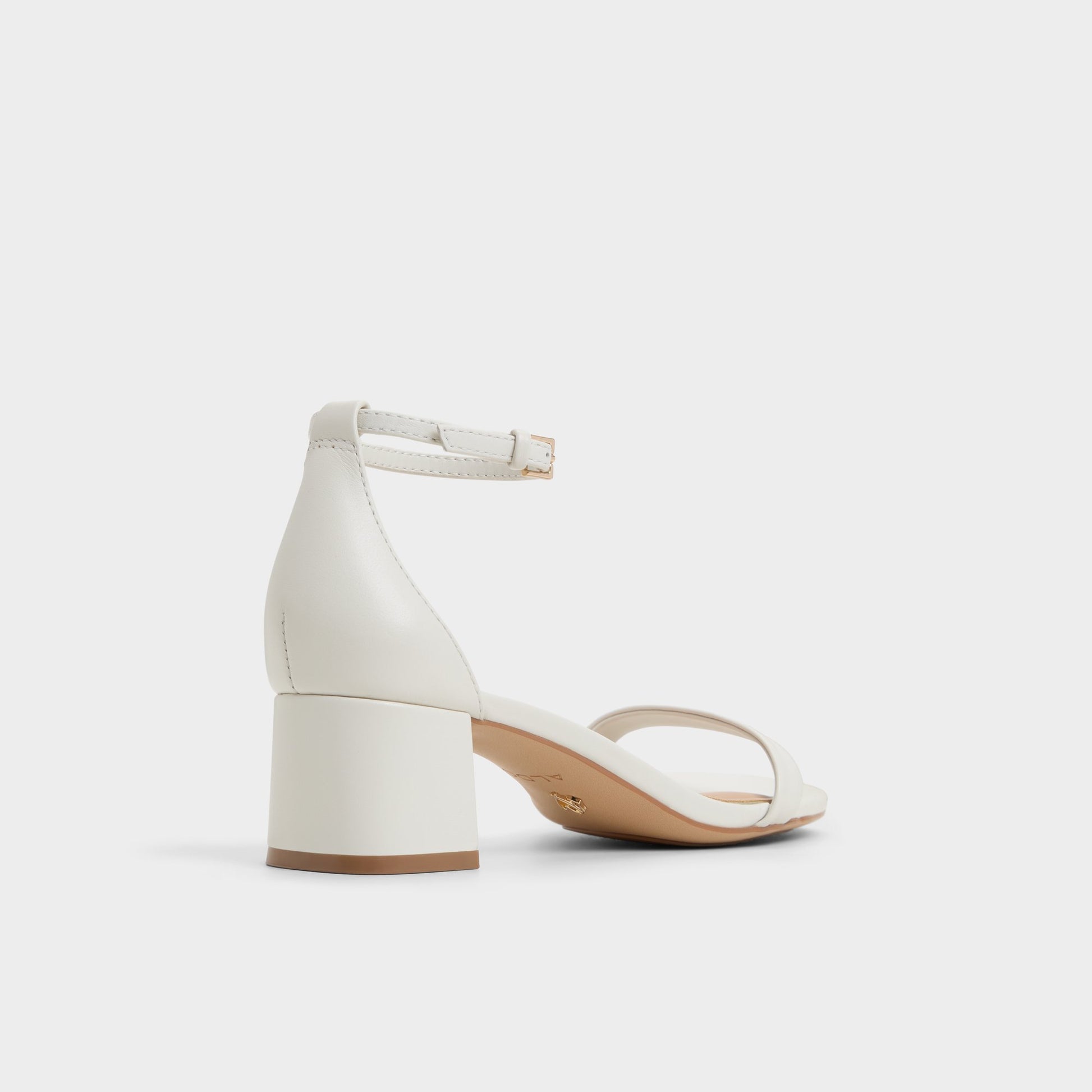Three-quarter angle of White/Bone Calliope Heeled sandal's back side