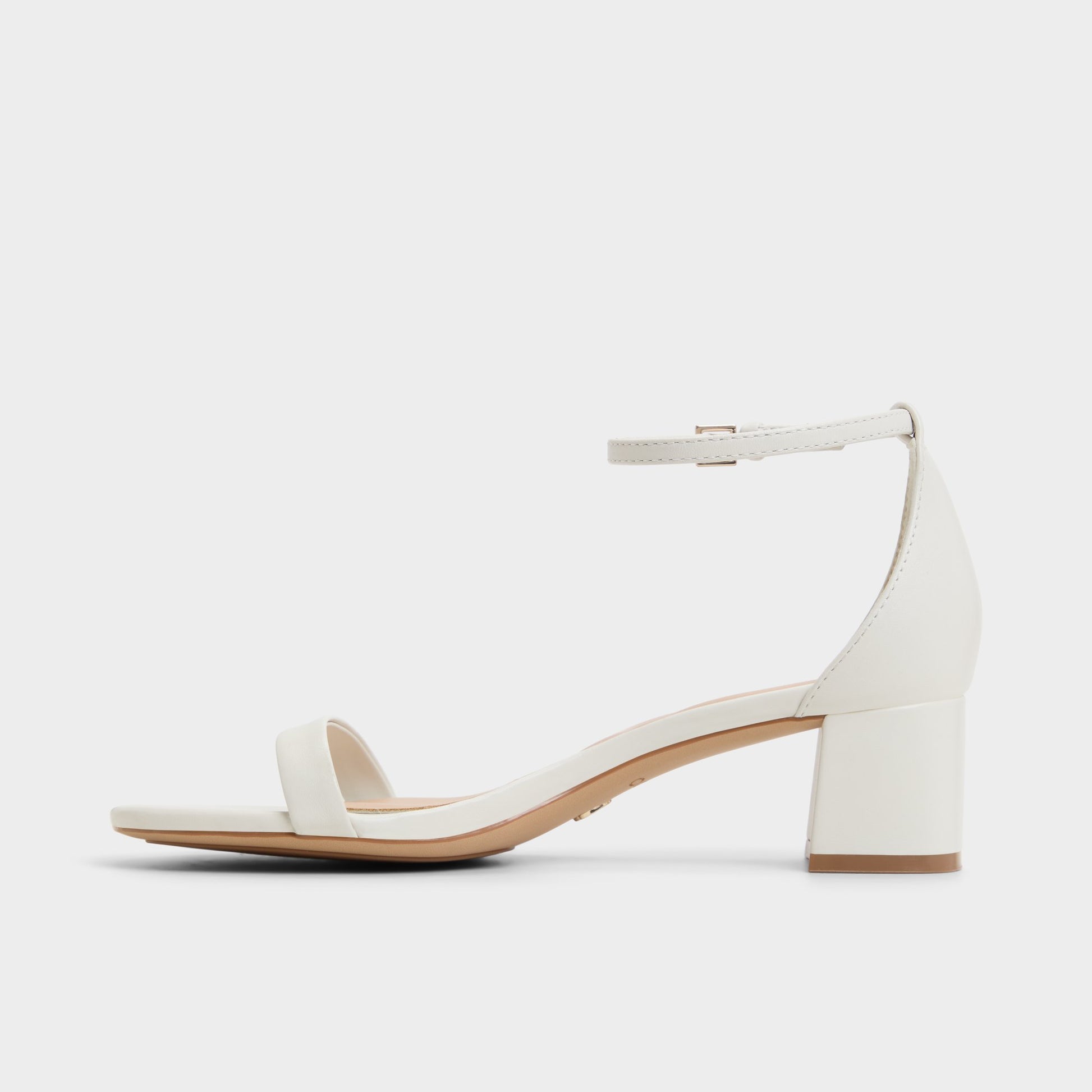 Side view of White/Bone Calliope Heeled sandal