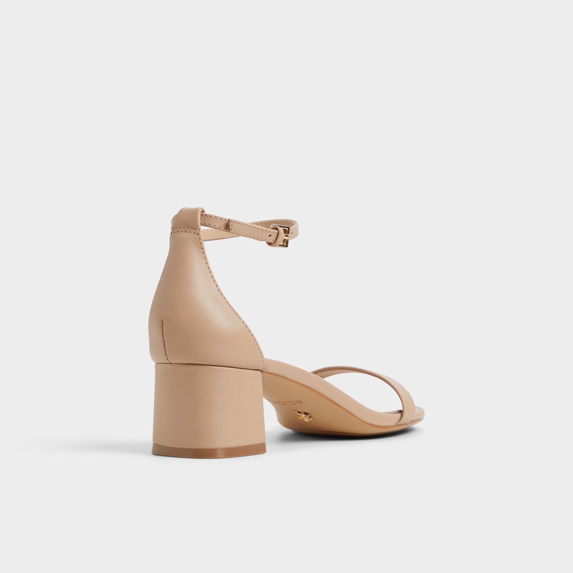 Three-quarter angle of Beige Calliope Heeled sandal's back side