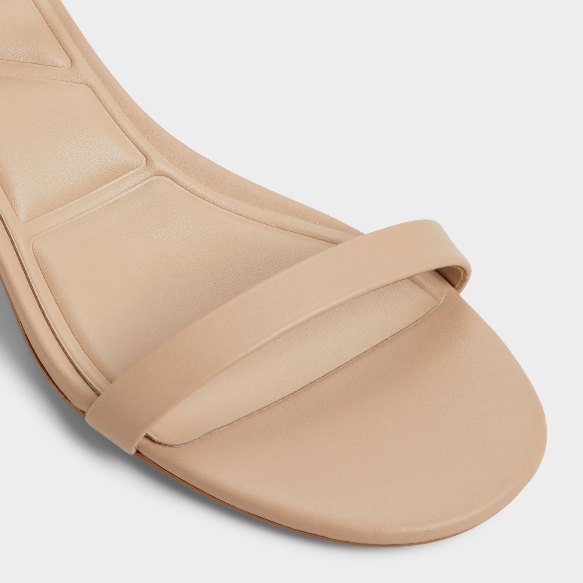 Close-up of the Beige Calliope Heeled sandal