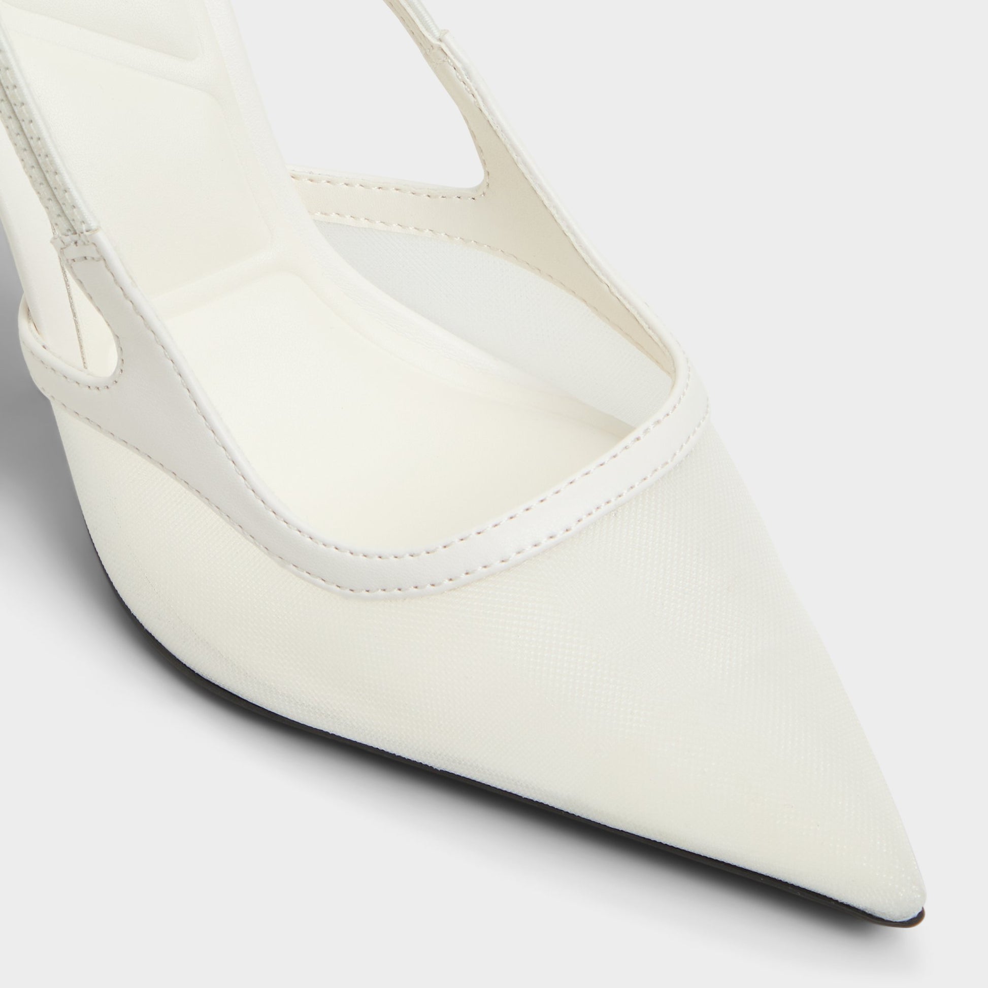 Close-up of the White Evania Slingback heel