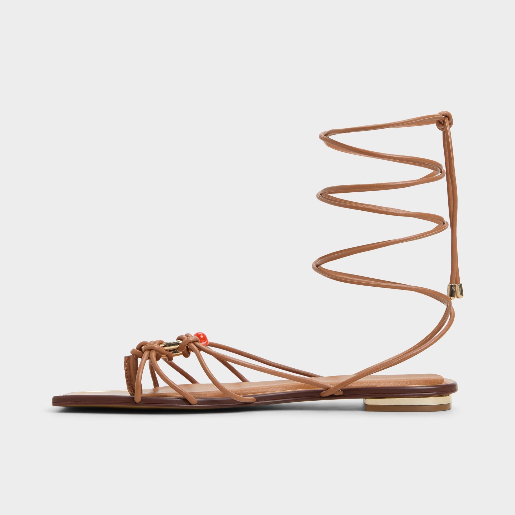 Side view of Medium Brown Nirena Strappy flat sandal