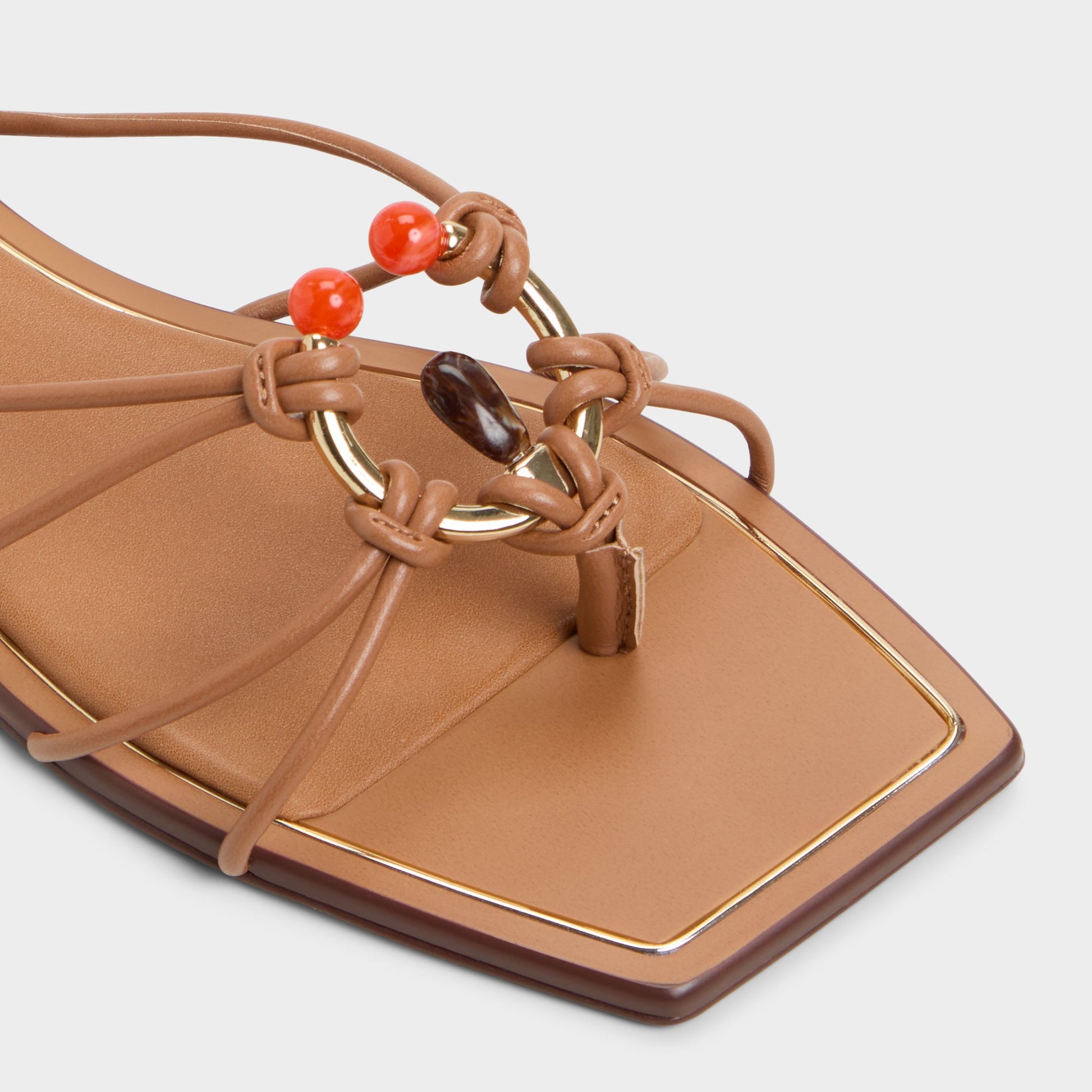 Close-up of the Medium Brown Nirena Strappy flat sandal