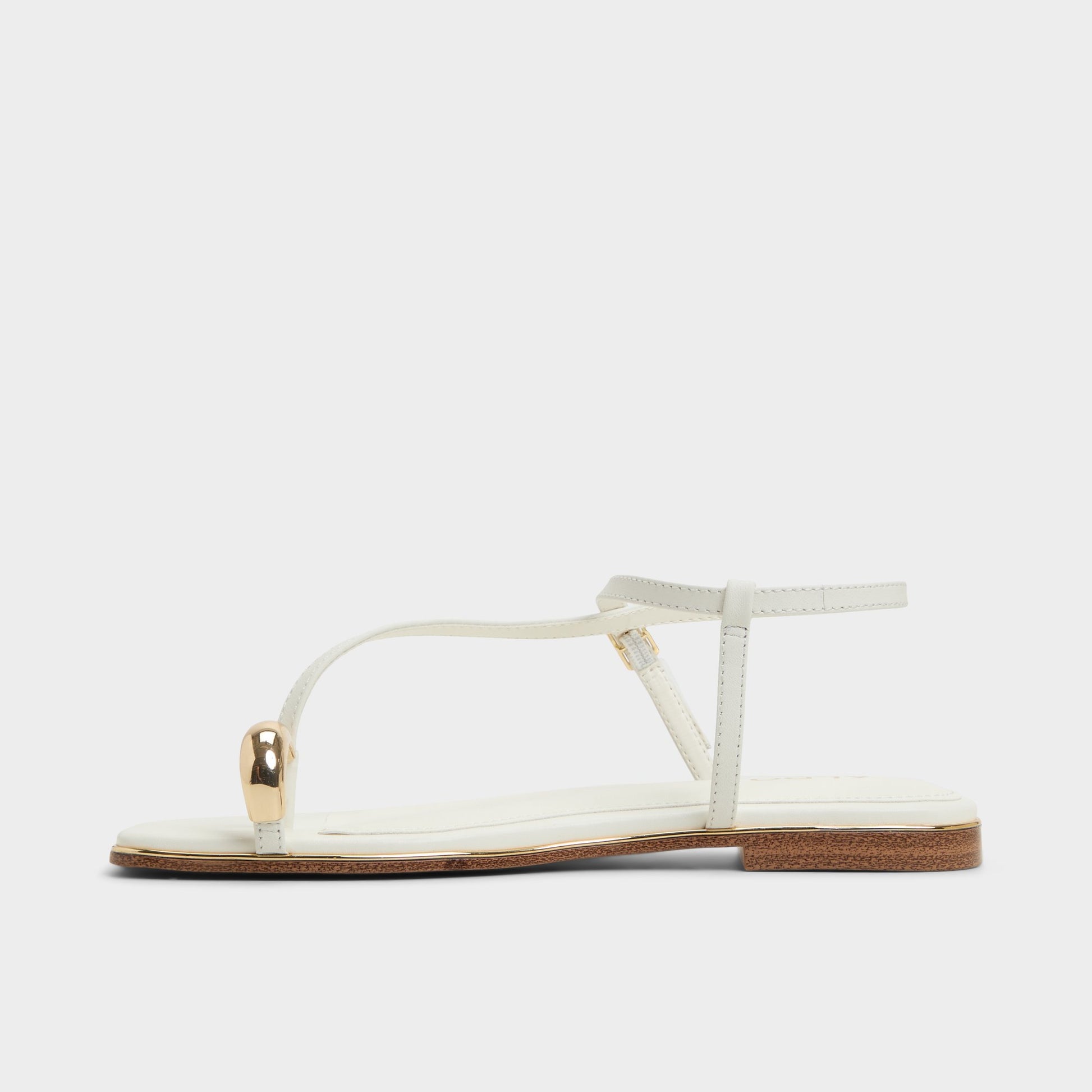 Side view of White Jomalina Strappy flat sandal