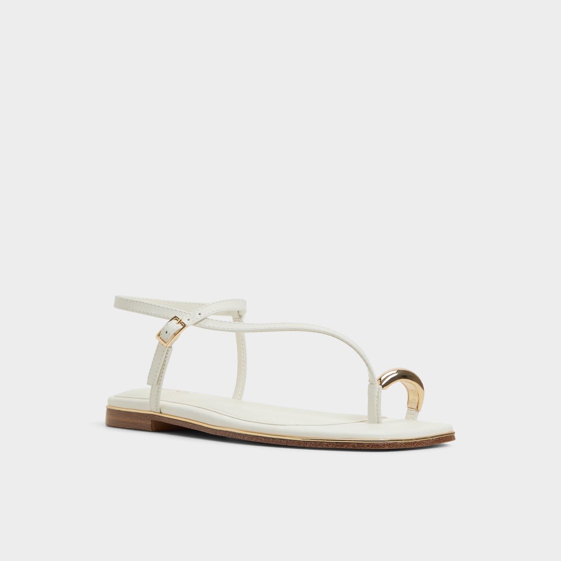 Three-quarter angle of White Jomalina Strappy flat sandal's front side
