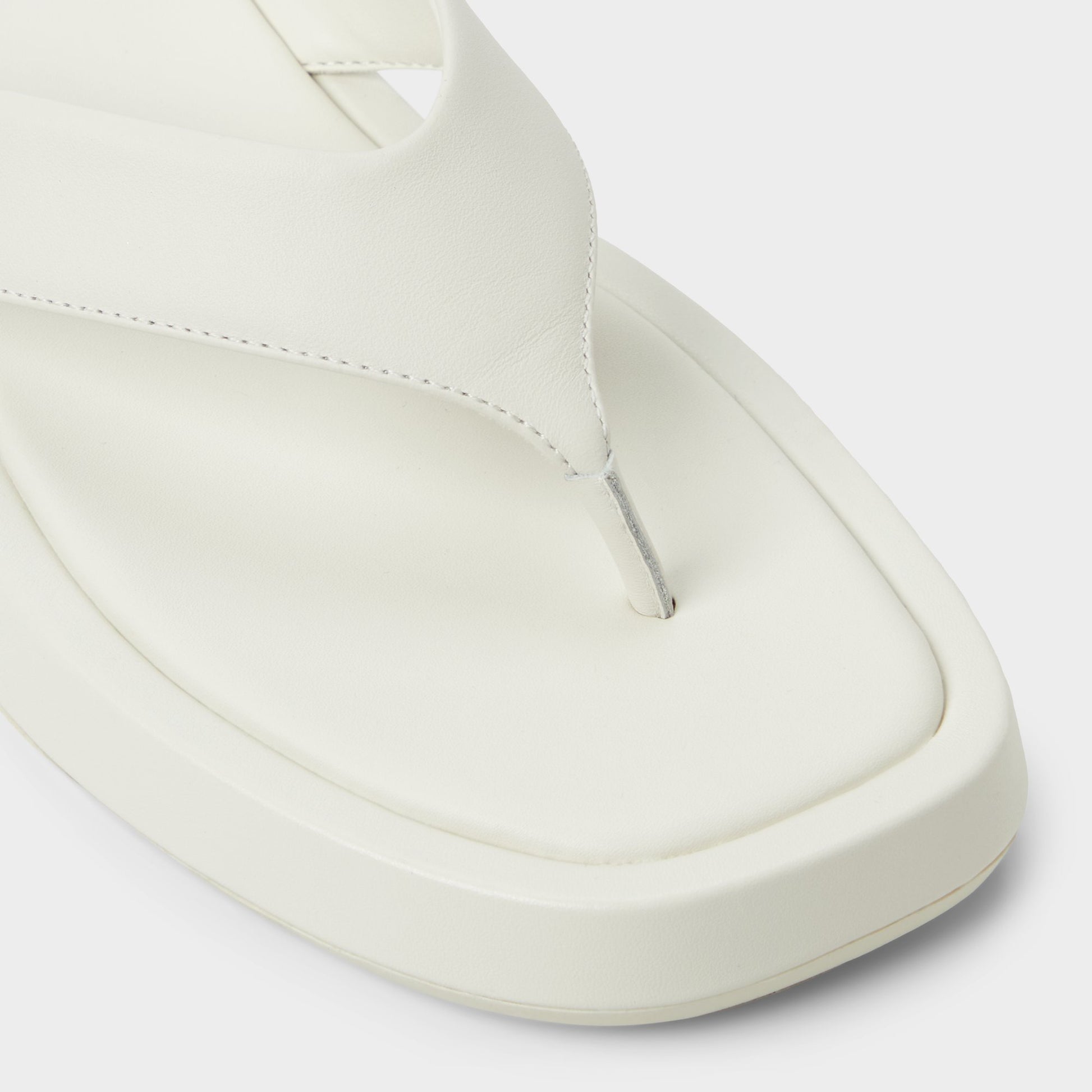 Close-up of the White/Bone Grettle Flip flop