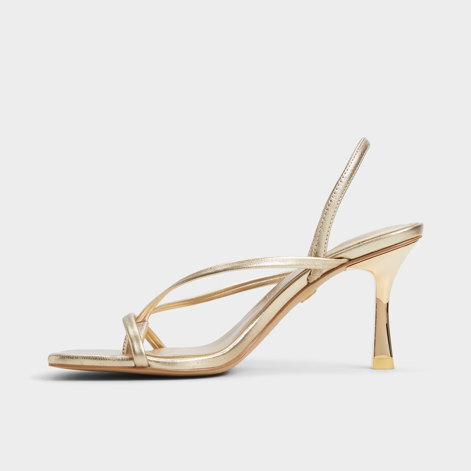 Side view of Gold Riva Sling back heeled sandal