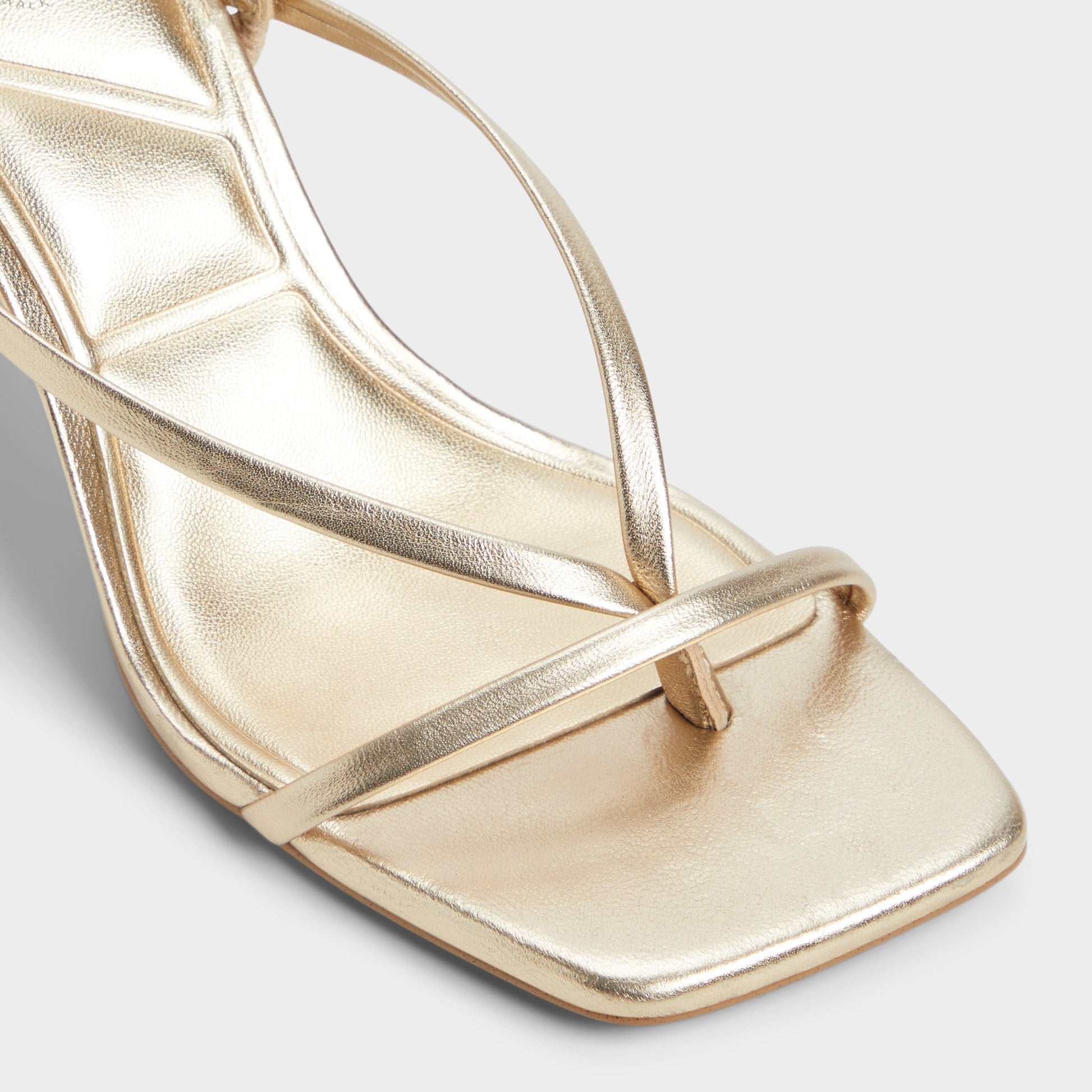 Close-up of the Gold Riva Sling back heeled sandal