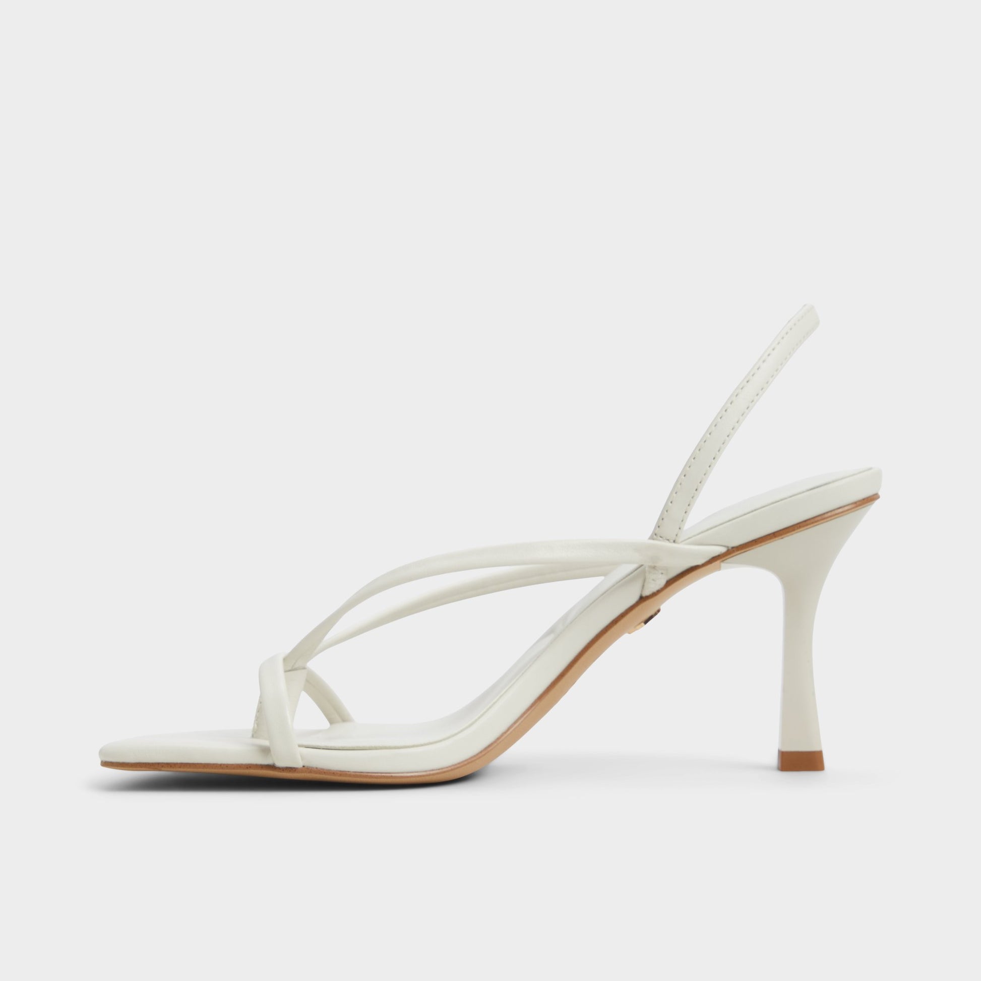 Side view of White/Bone Riva Sling back heeled sandal