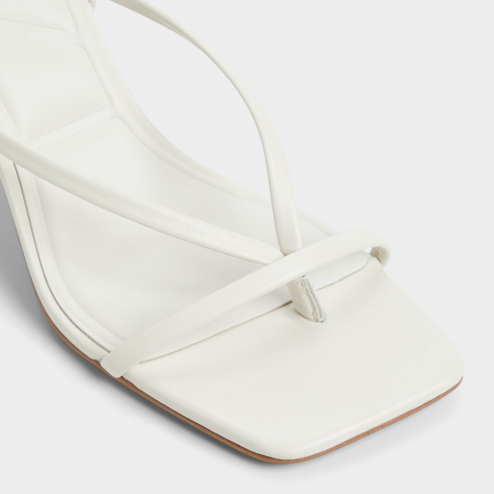 Close-up of the White/Bone Riva Sling back heeled sandal