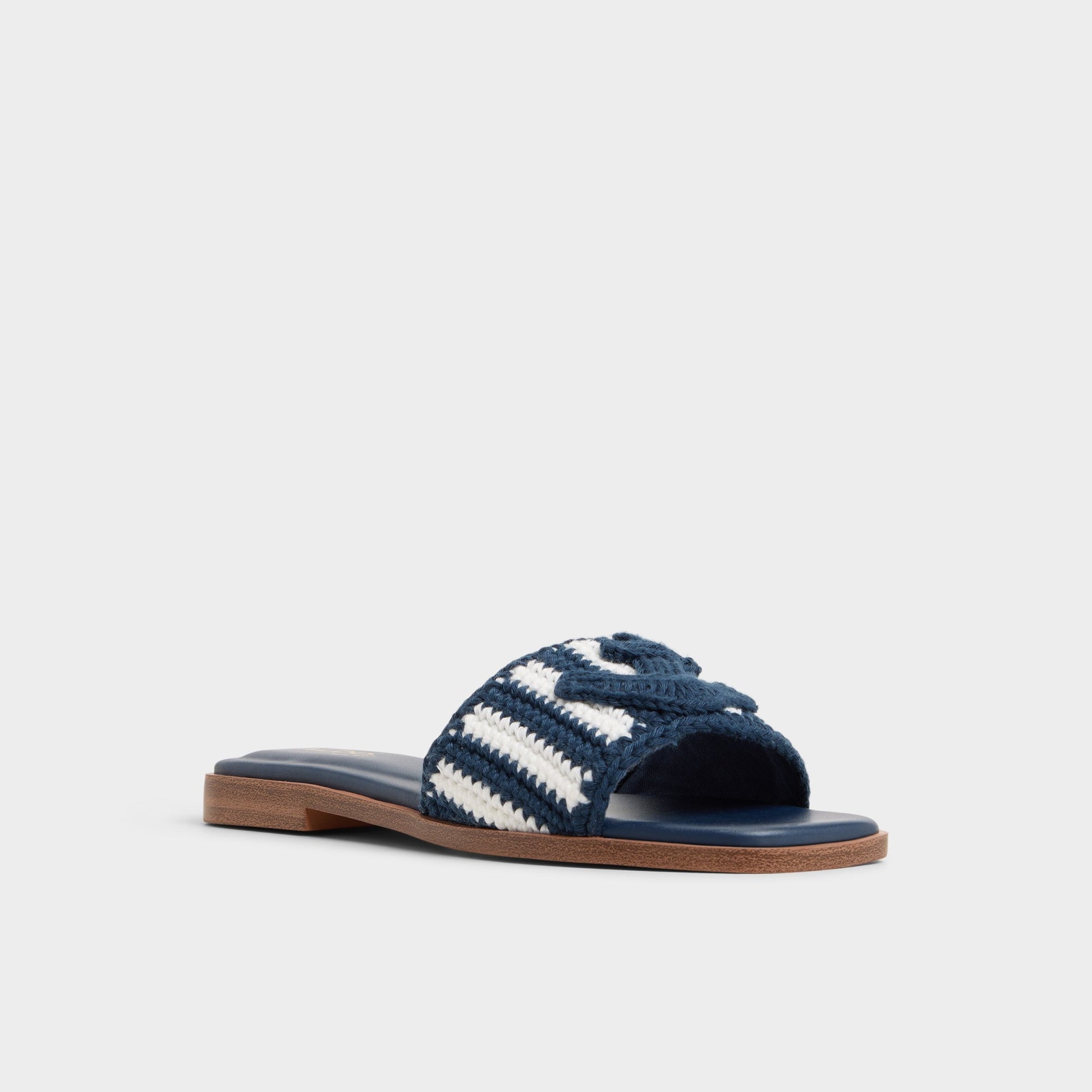 Three-quarter angle of Blue Combo Sabbia Slide sandal's front side