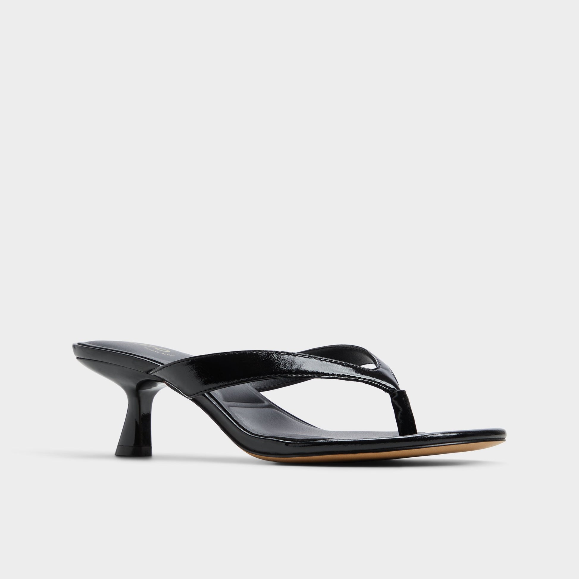 Three-quarter angle of Black Jump Heeled flip flop's front side