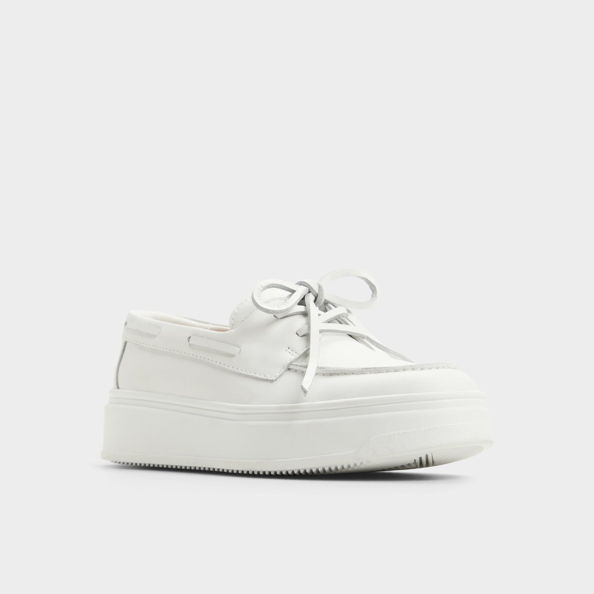 Three-quarter angle of Open White Wildbreeze Boat shoe's front side