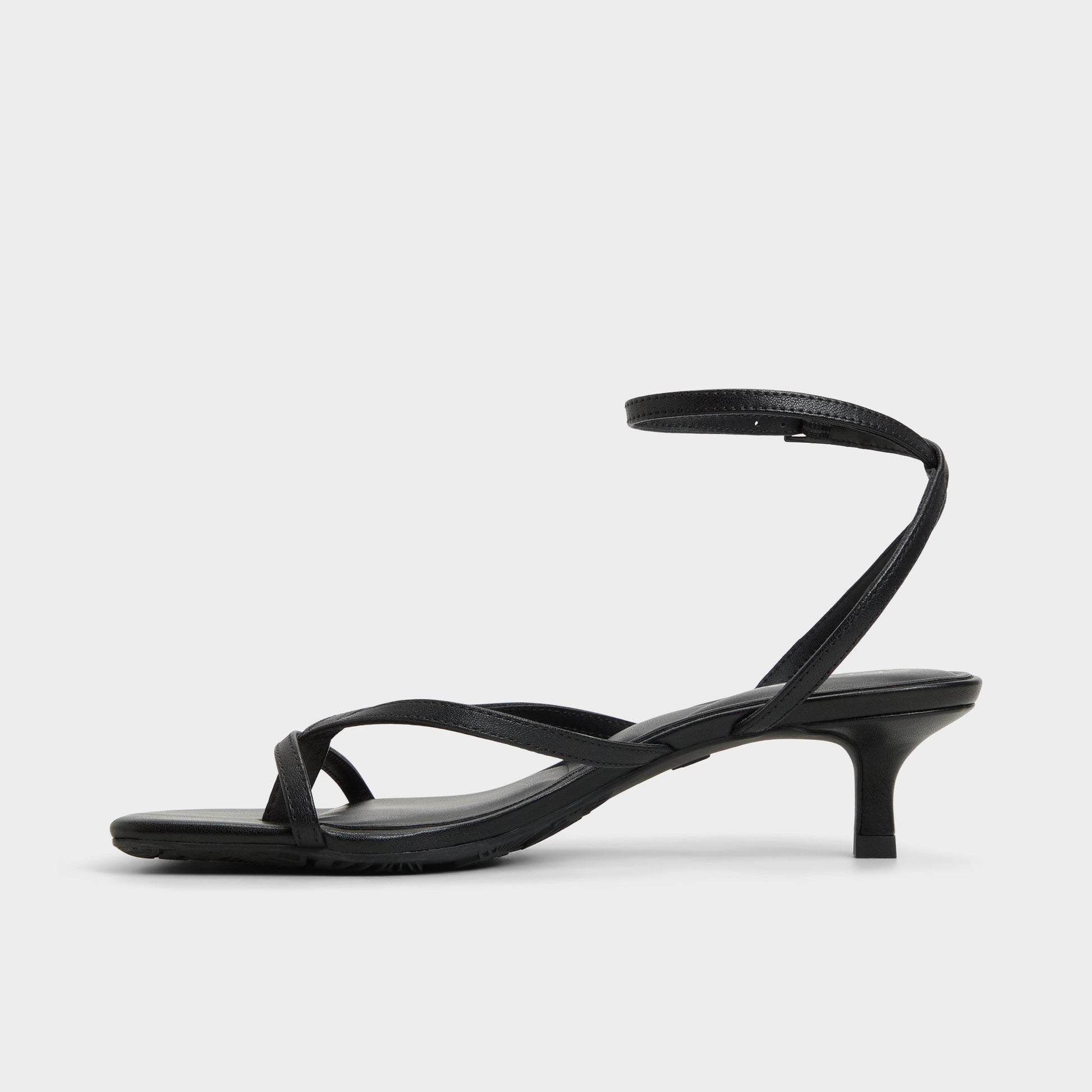 Side view of Black Soffie Strappy heeled sandal
