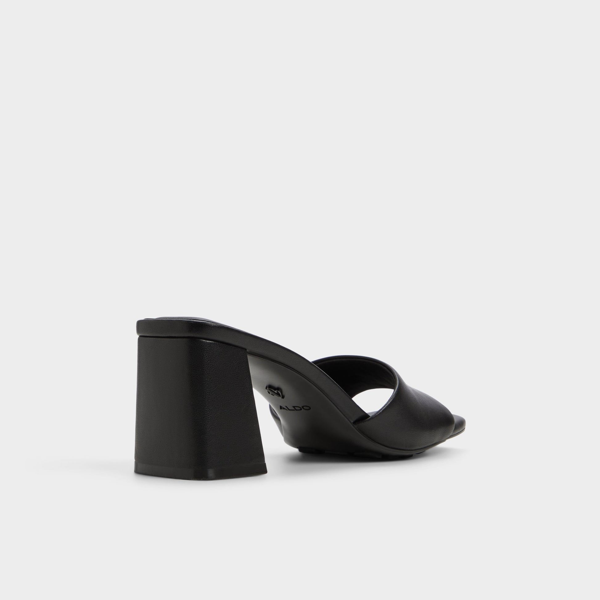 Three-quarter angle of Black Tisha Heeled mule's back side
