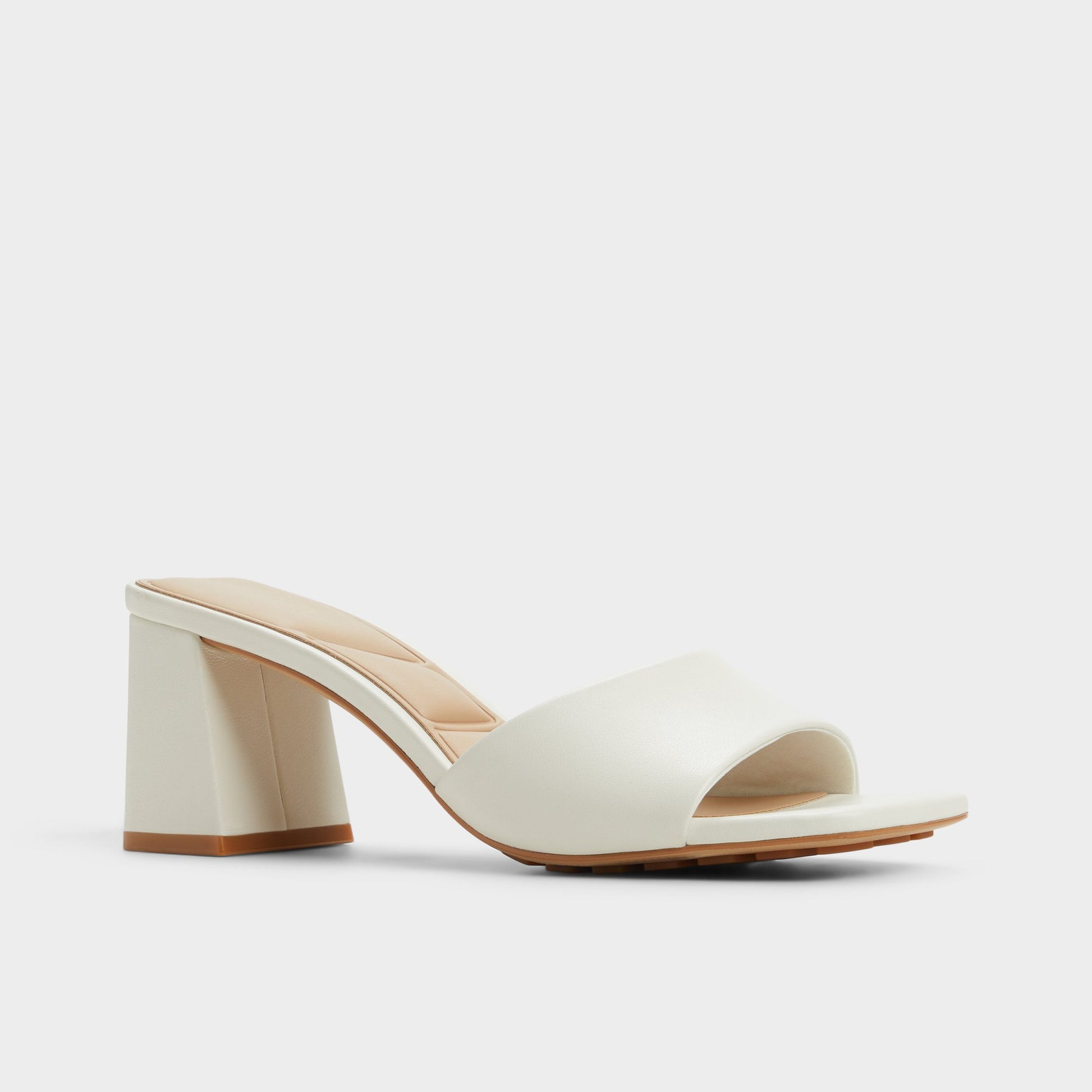 Three-quarter angle of White Tisha Heeled mule's front side