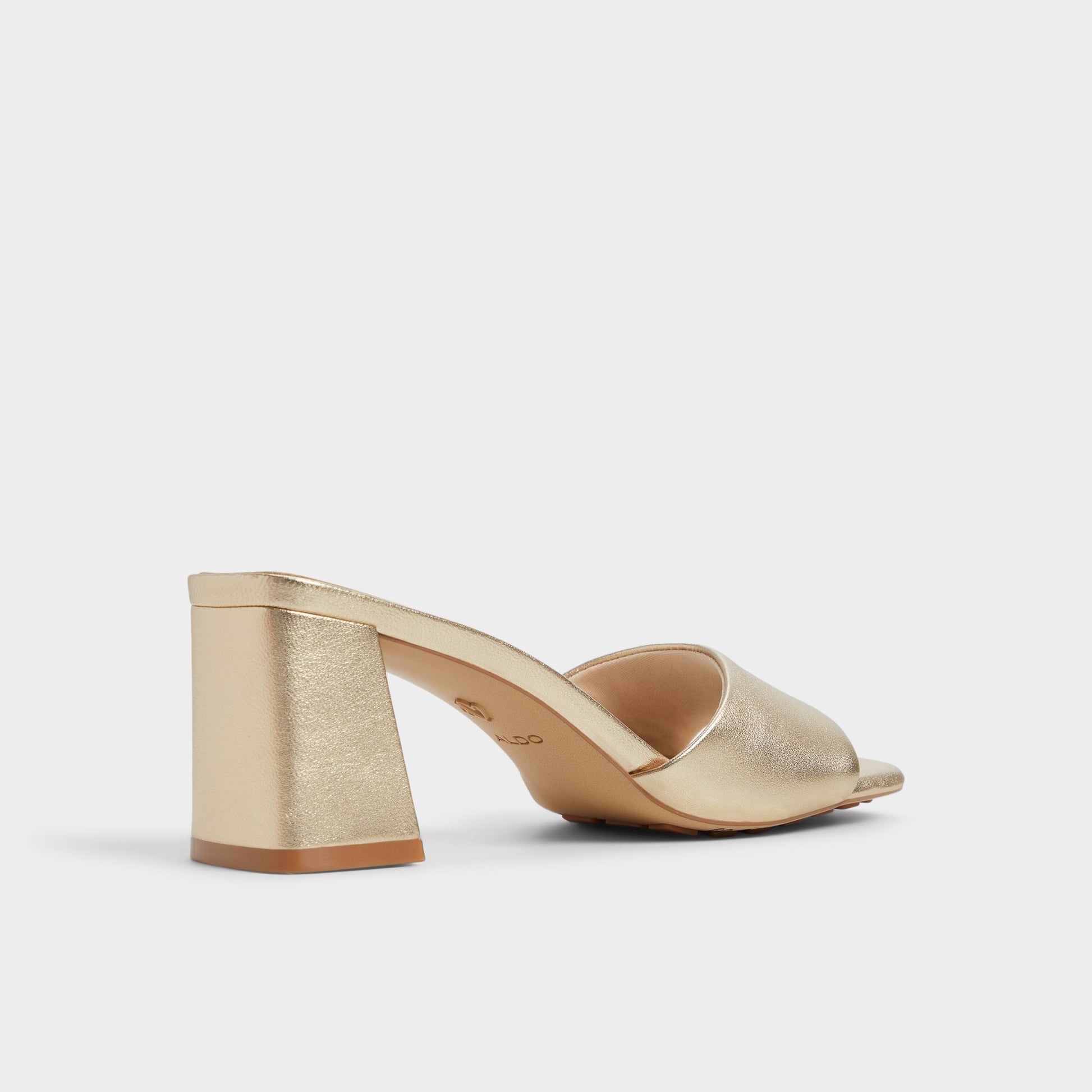 Three-quarter angle of Gold Tisha Heeled mule's back side