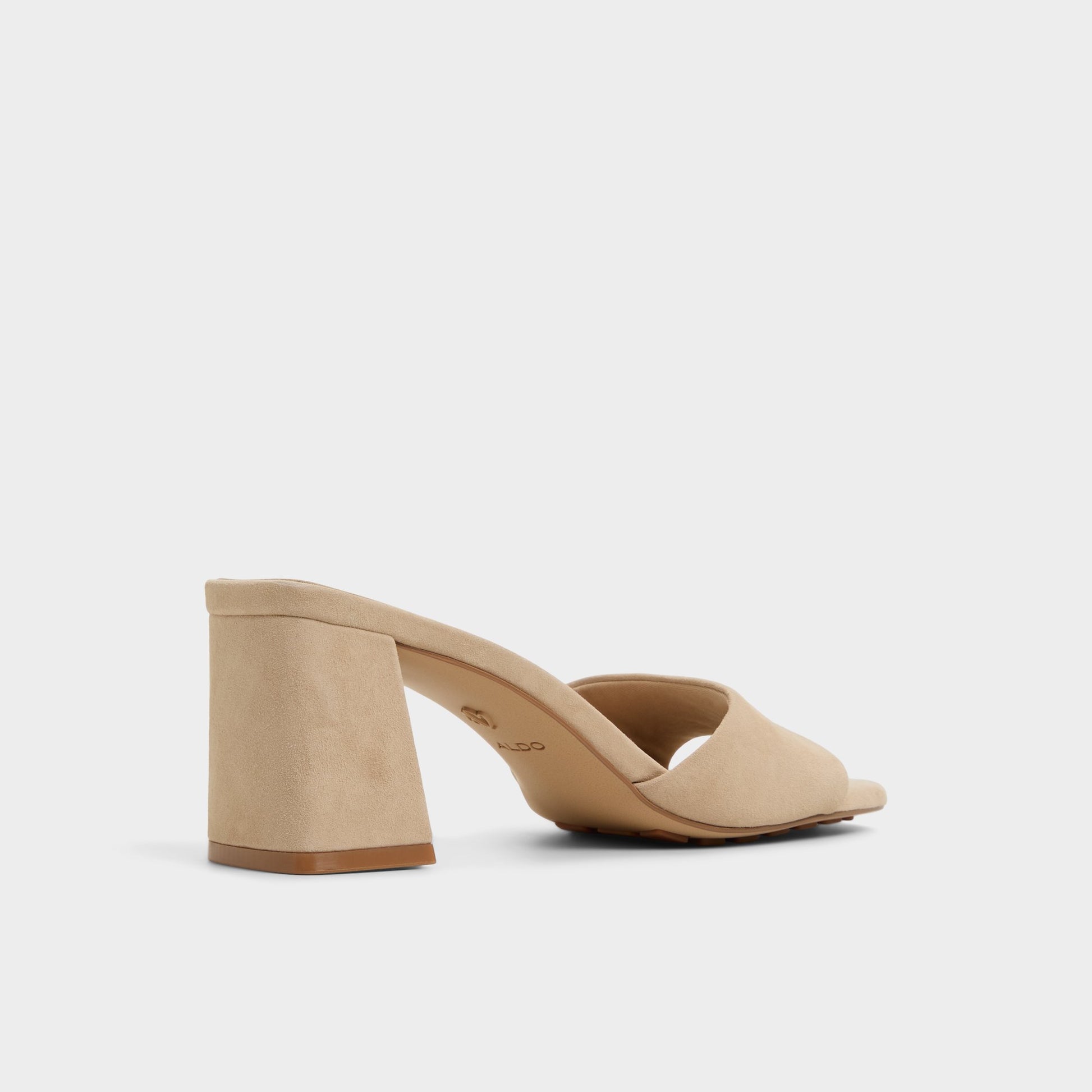 Three-quarter angle of Beige Tisha Heeled mule's back side