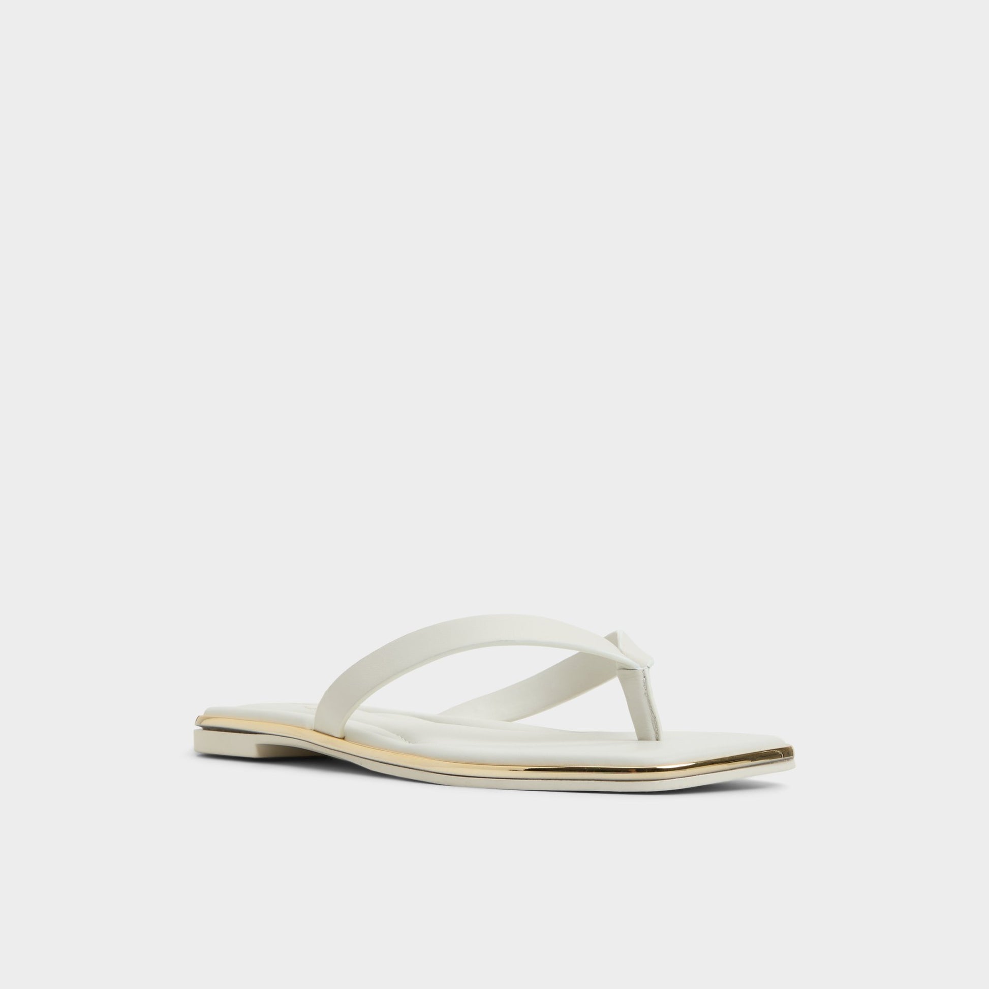 Three-quarter angle of White/Bone Theao Flip flop's front side