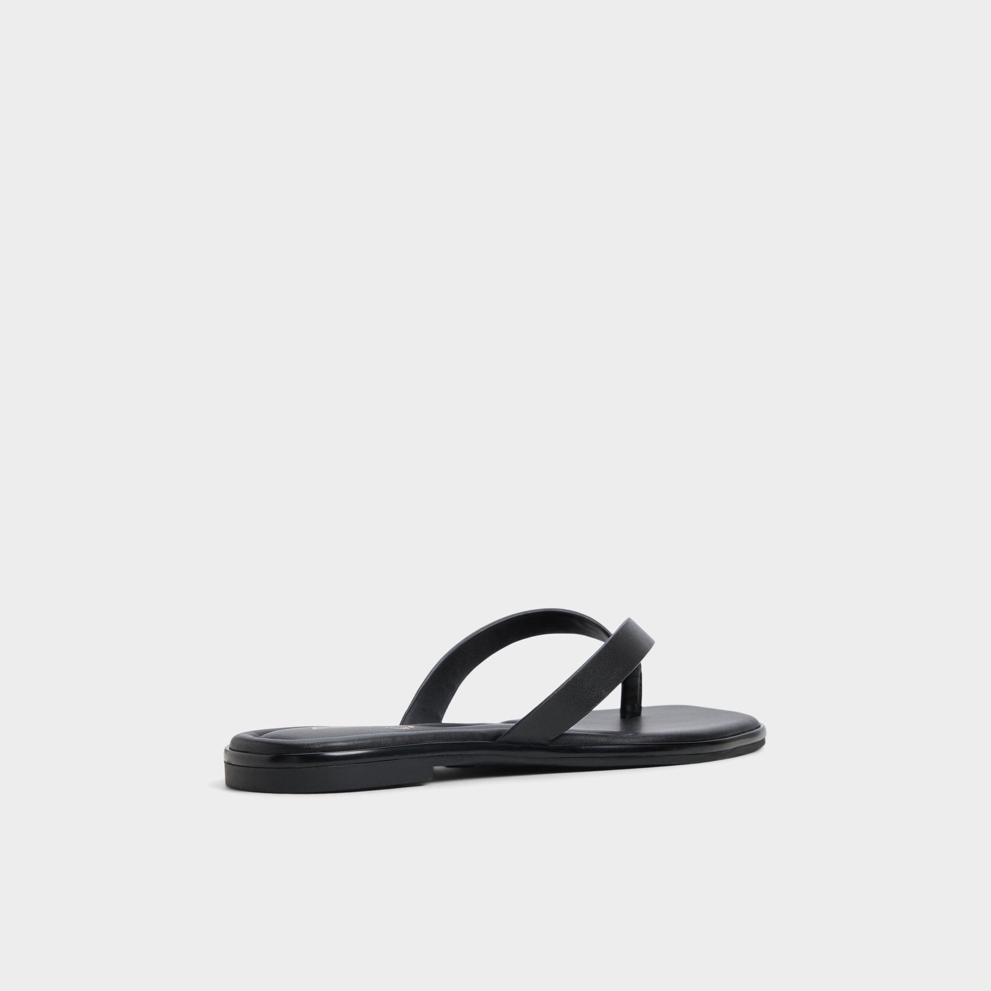 Three-quarter angle of Black Theao Flip flop's back side