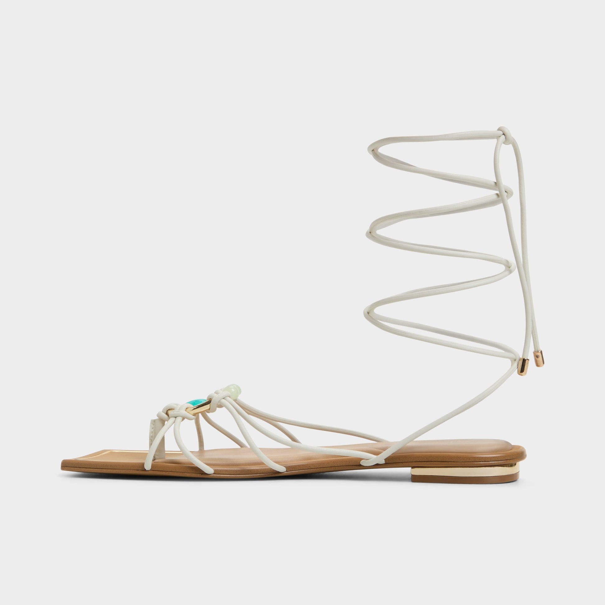 Side view of White/Bone Nirena Strappy flat sandal