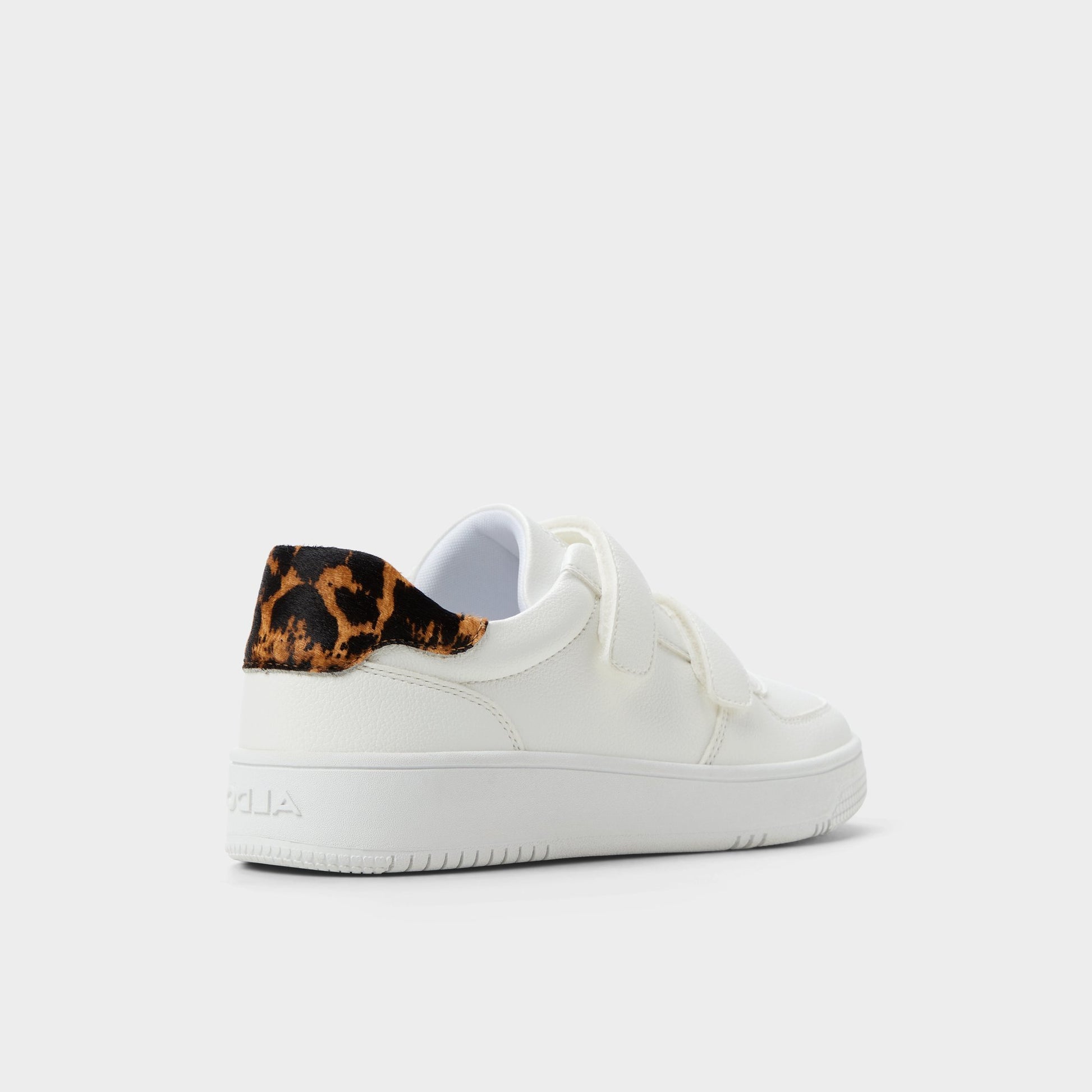 Three-quarter angle of White Combo 24-7kicks Jogger sneaker's back side