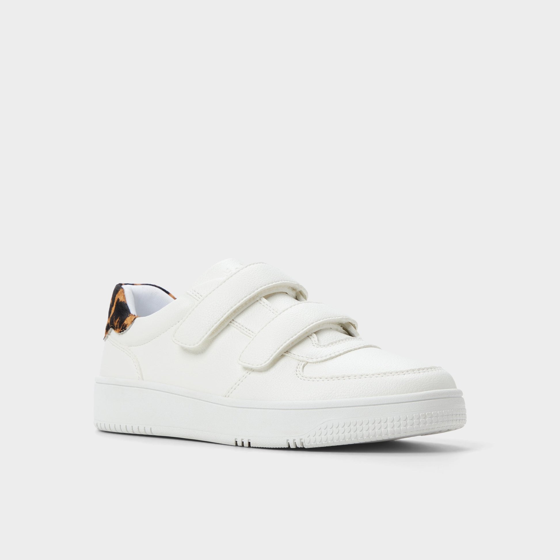 Three-quarter angle of White Combo 24-7kicks Jogger sneaker's front side