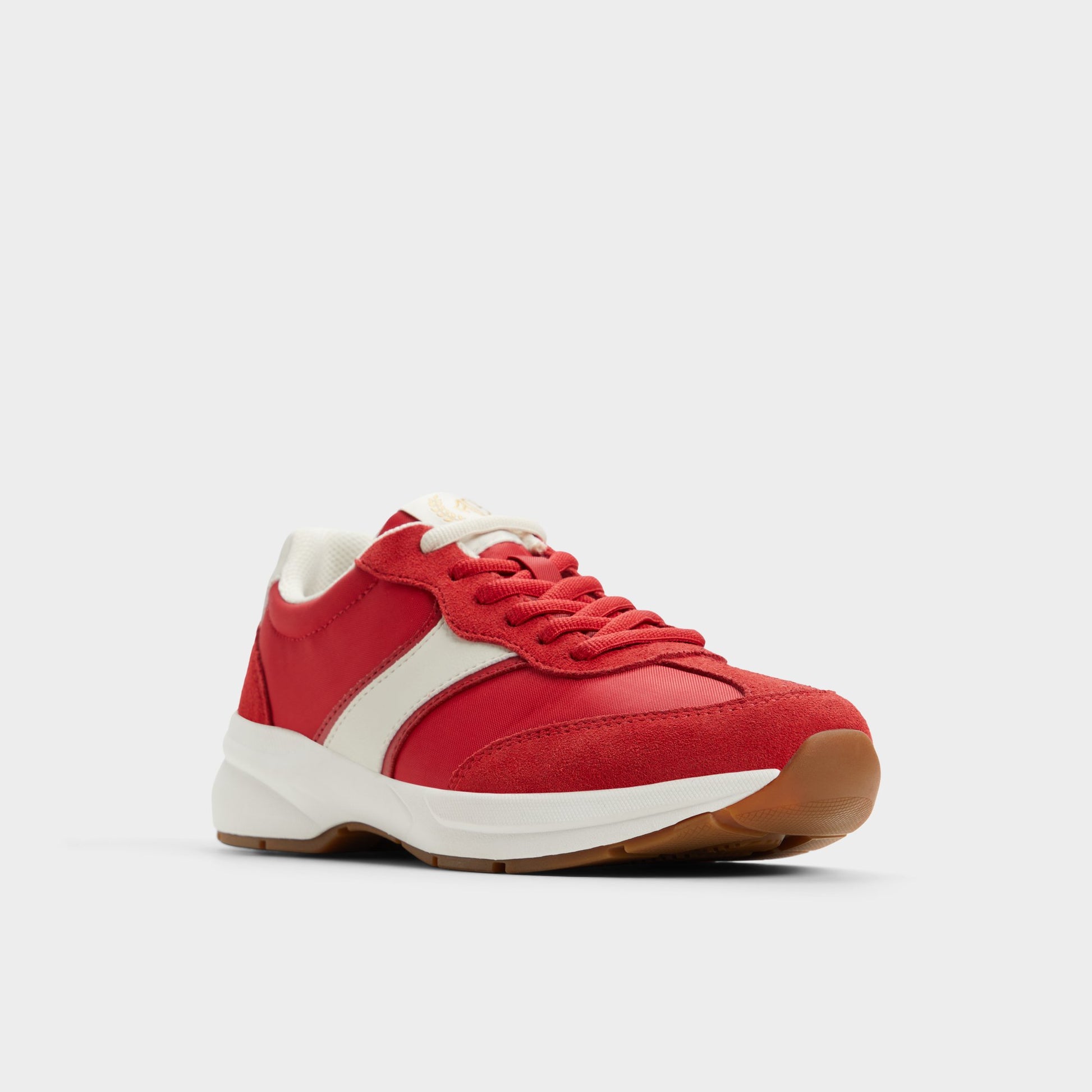 Three-quarter angle of Medium Red Clubchic Jogger sneaker's front side
