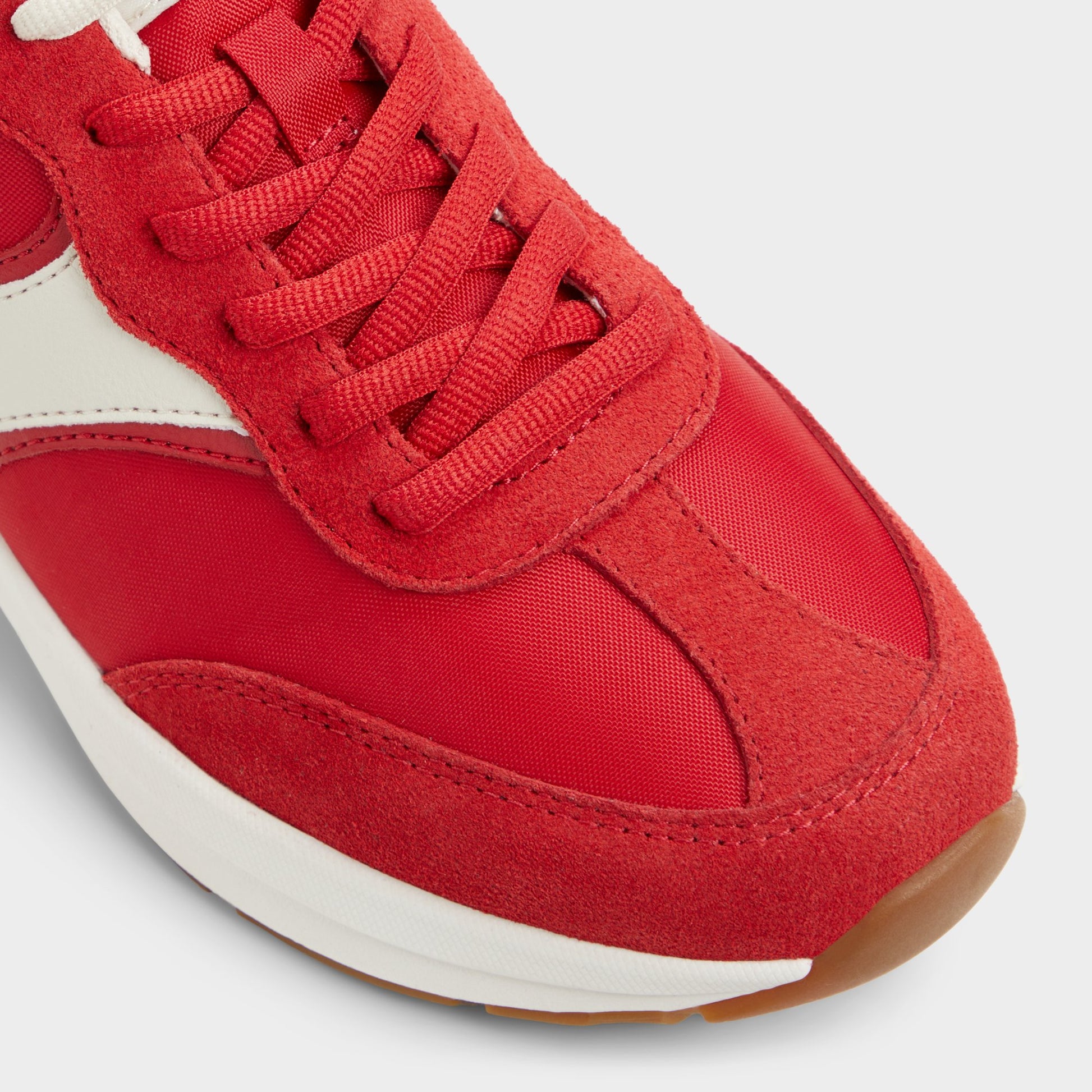 Close-up of the Medium Red Clubchic Jogger sneaker