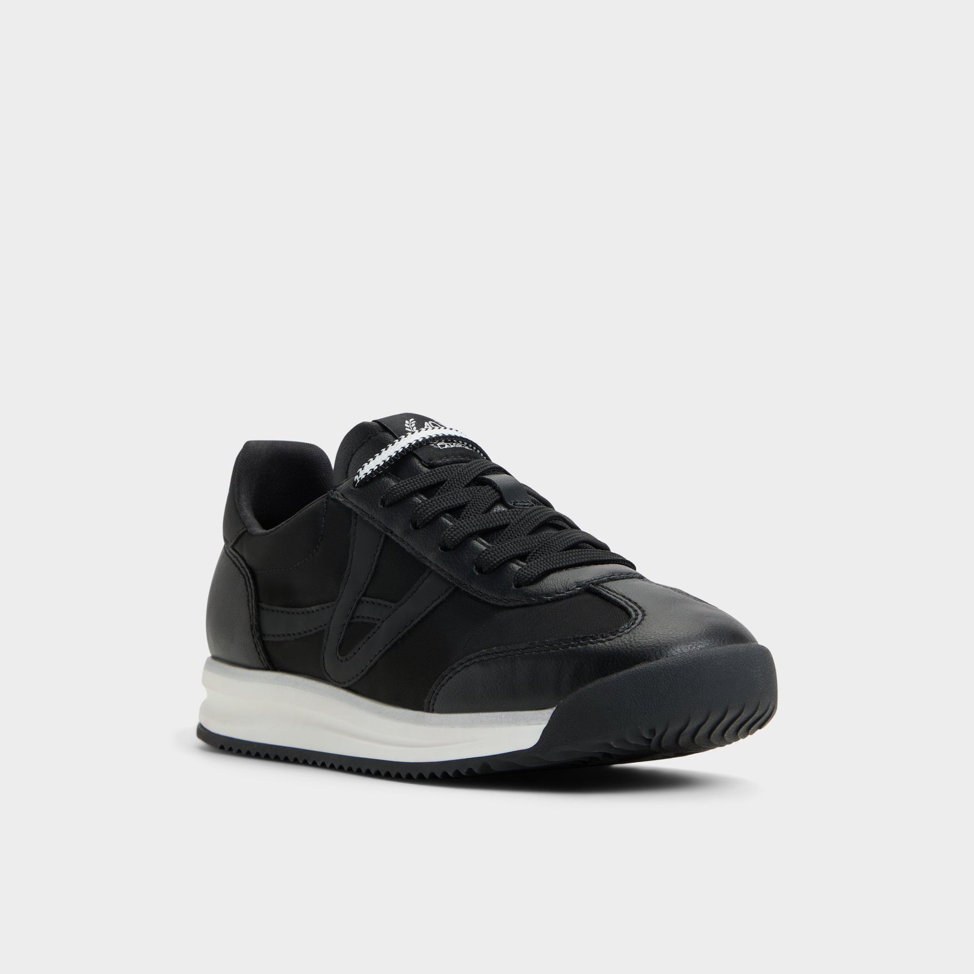 Three-quarter angle of Black Stepcount Jogger sneaker's front side