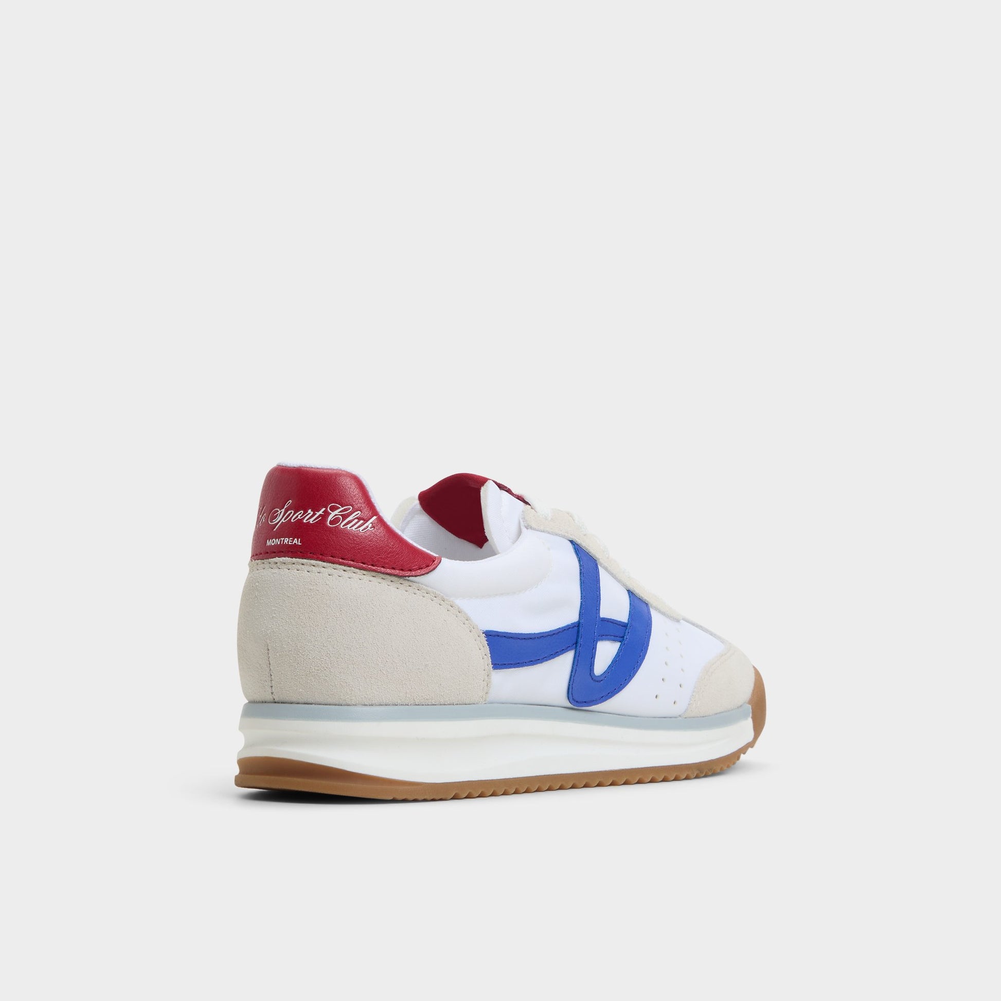Three-quarter angle of White/Blue Stepcount Jogger sneaker's back side