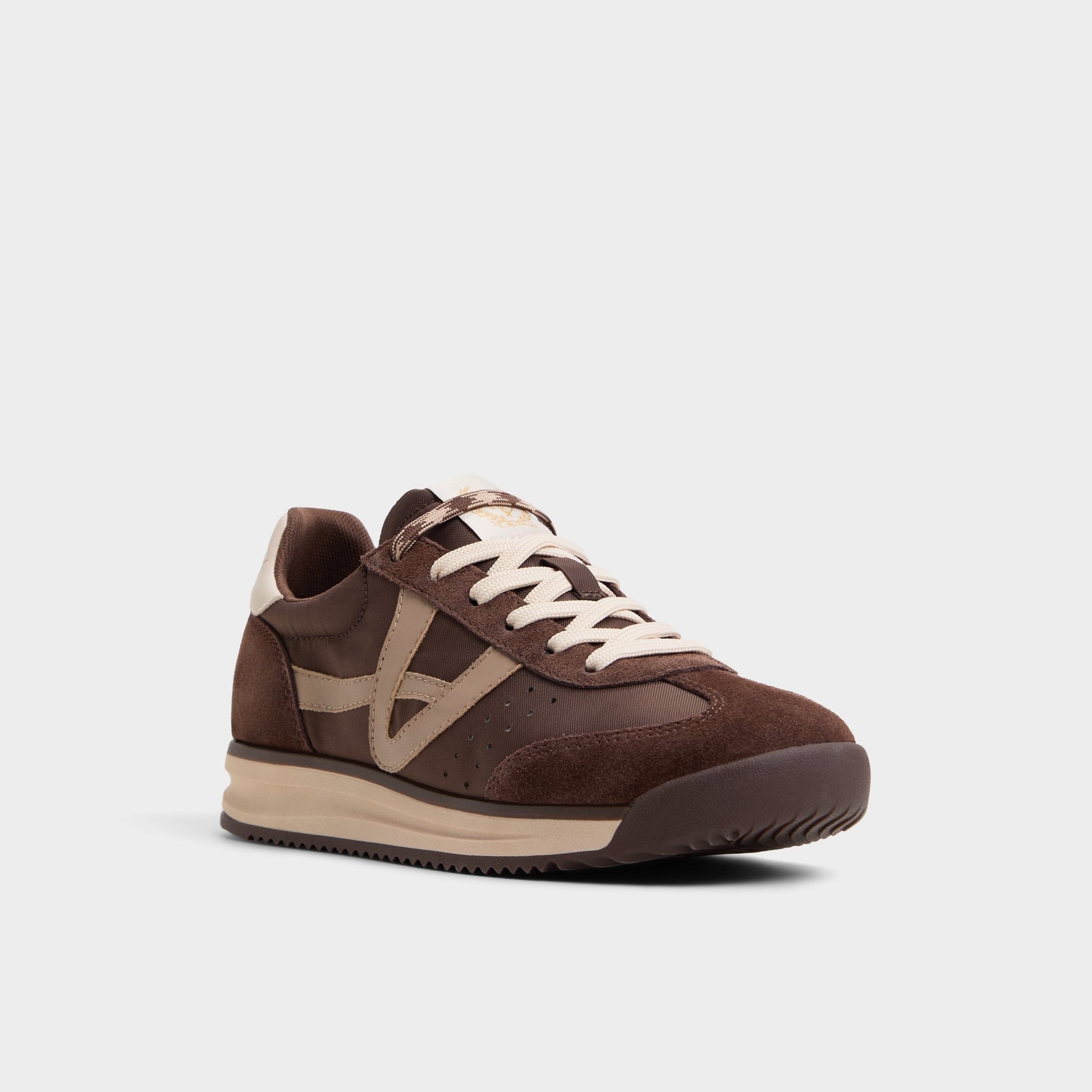 Three-quarter angle of Medium Brown Stepcount Jogger sneaker's front side
