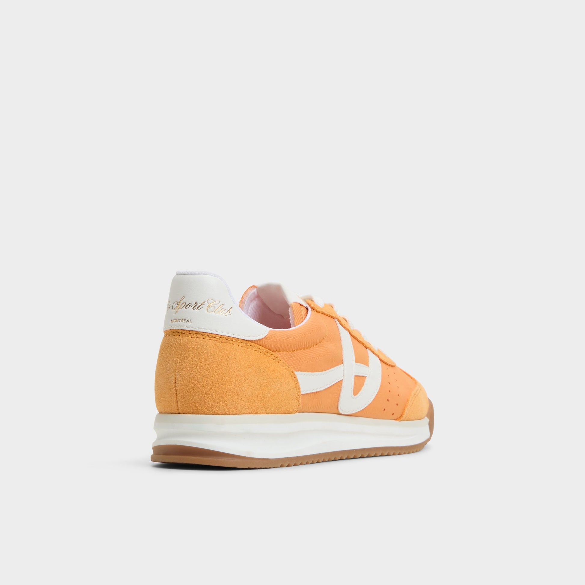 Three-quarter angle of Orange Stepcount Jogger sneaker's back side