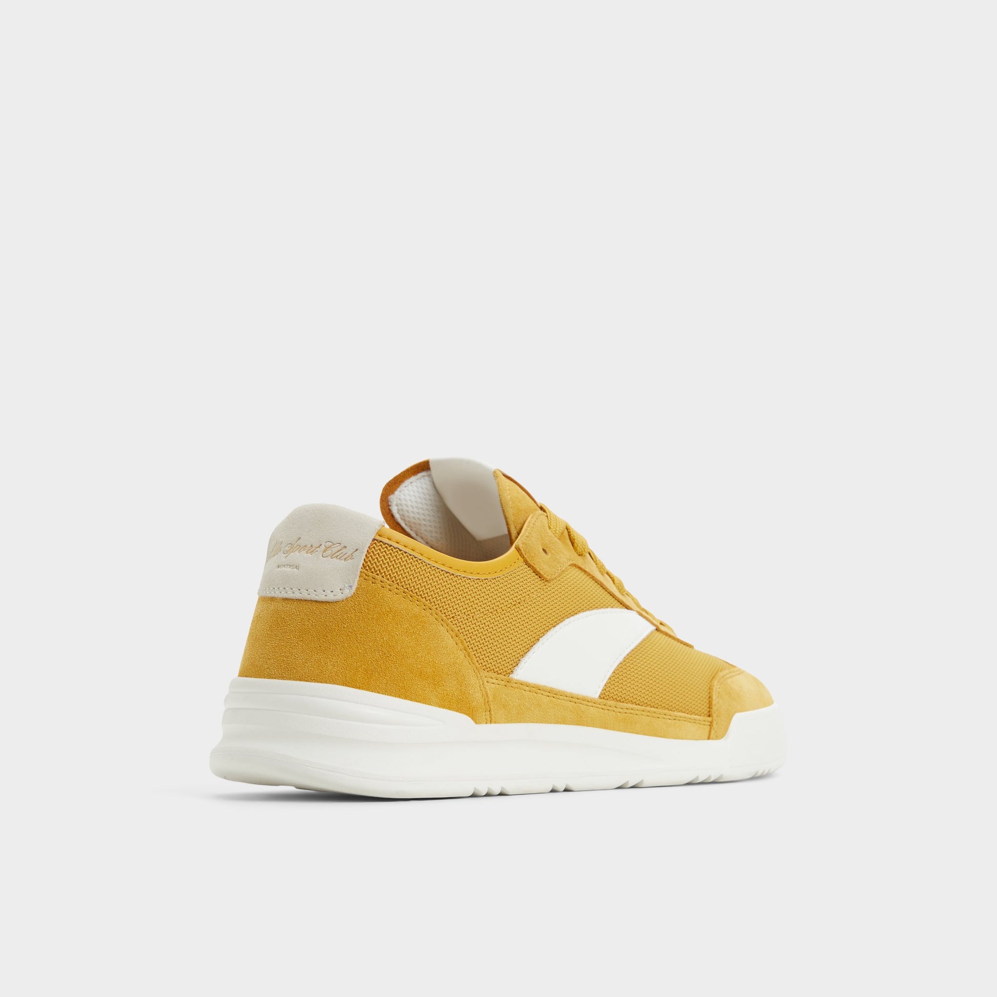 Three-quarter angle of Medium Yellow Clubmtl Low top sneaker's back side