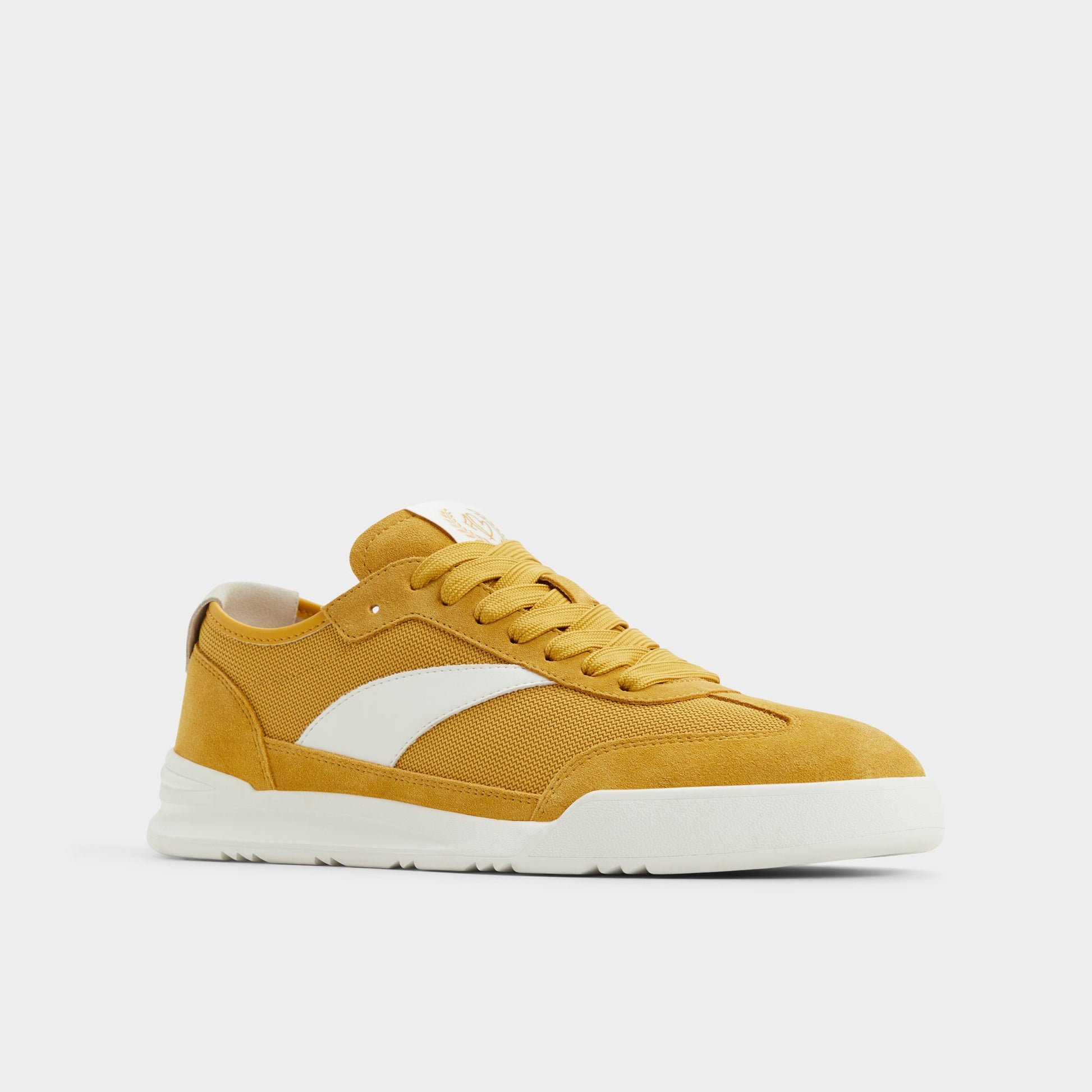 Three-quarter angle of Medium Yellow Clubmtl Low top sneaker's front side