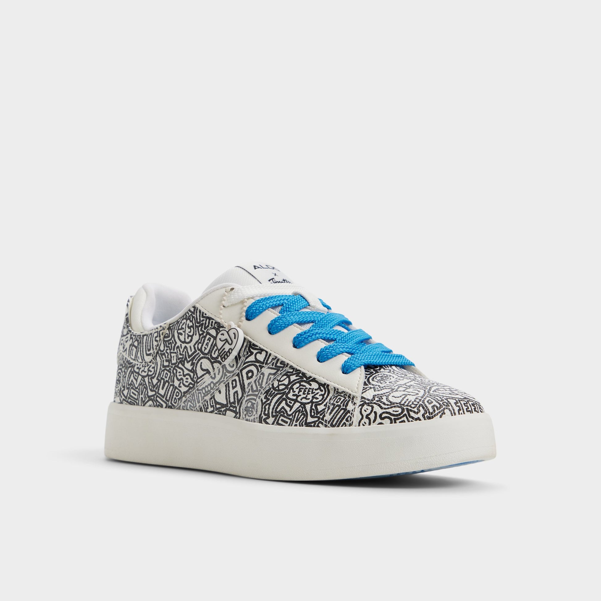 Three-quarter angle of White/Black Timothy Goodman Women's low top sneaker's front side