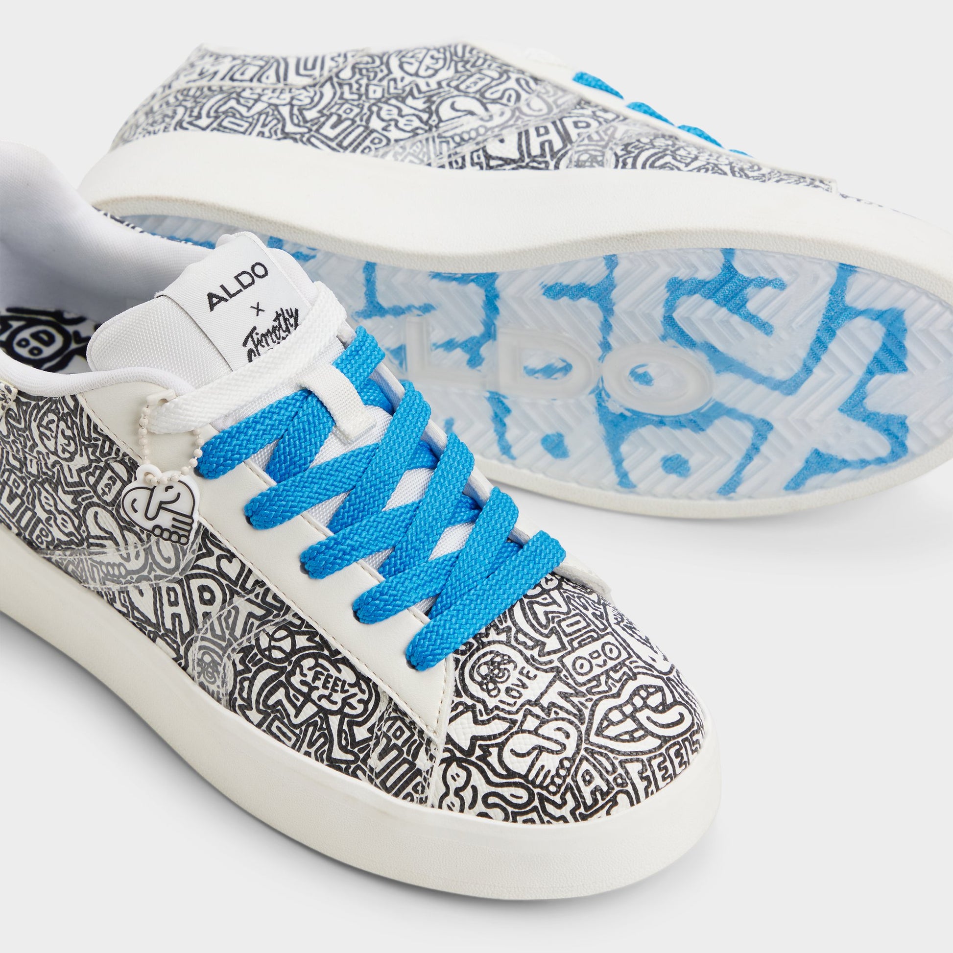 Highlighted view of a pair of White/Black Timothy Goodman Women's low top sneakers