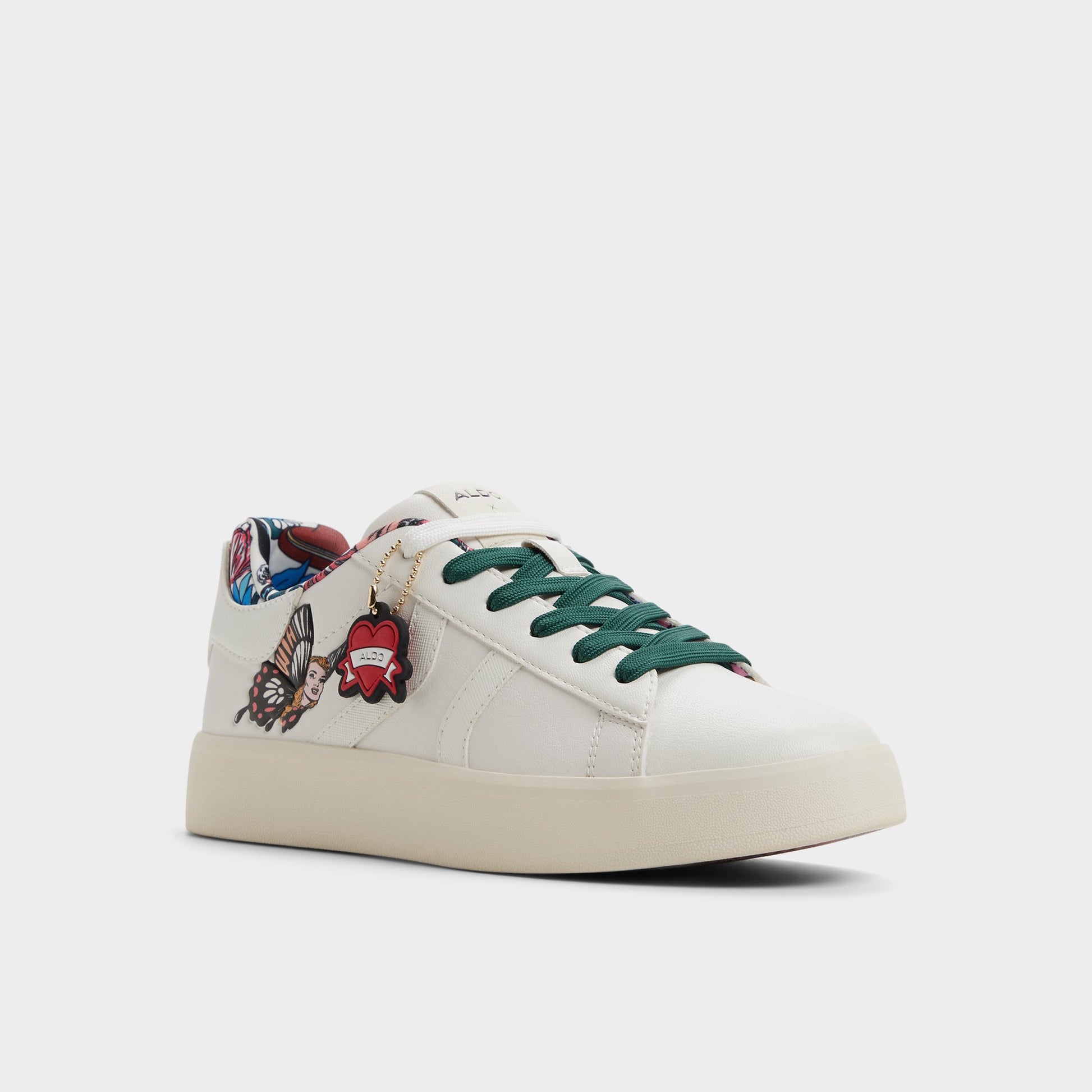 Three-quarter angle of White multi Whatisadam Women's low top sneaker's front side