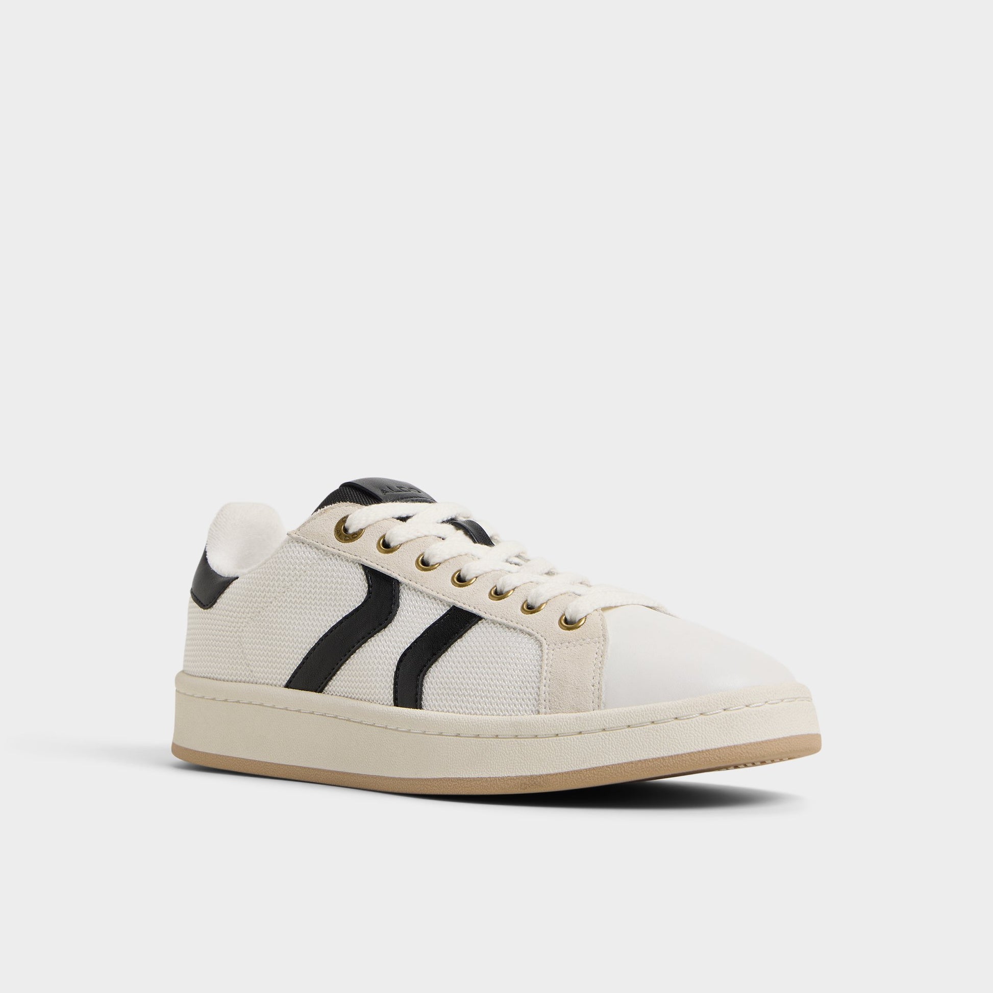 Three-quarter angle of White Retrokicks Low top sneaker's front side
