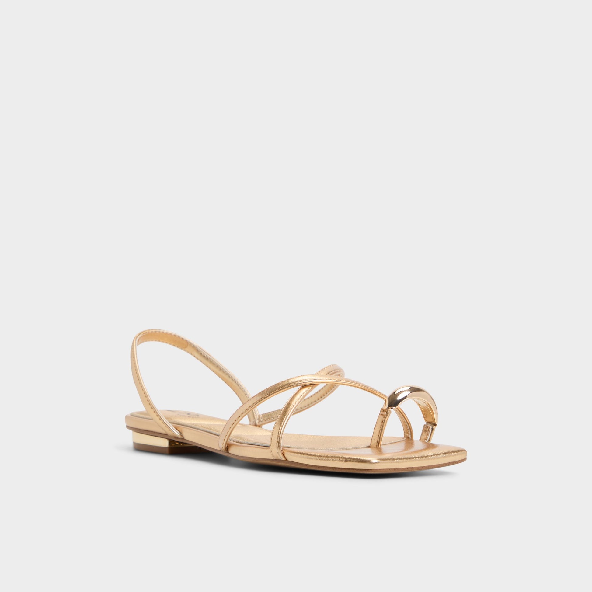 Three-quarter angle of Gold Synthesa Flip flop's front side