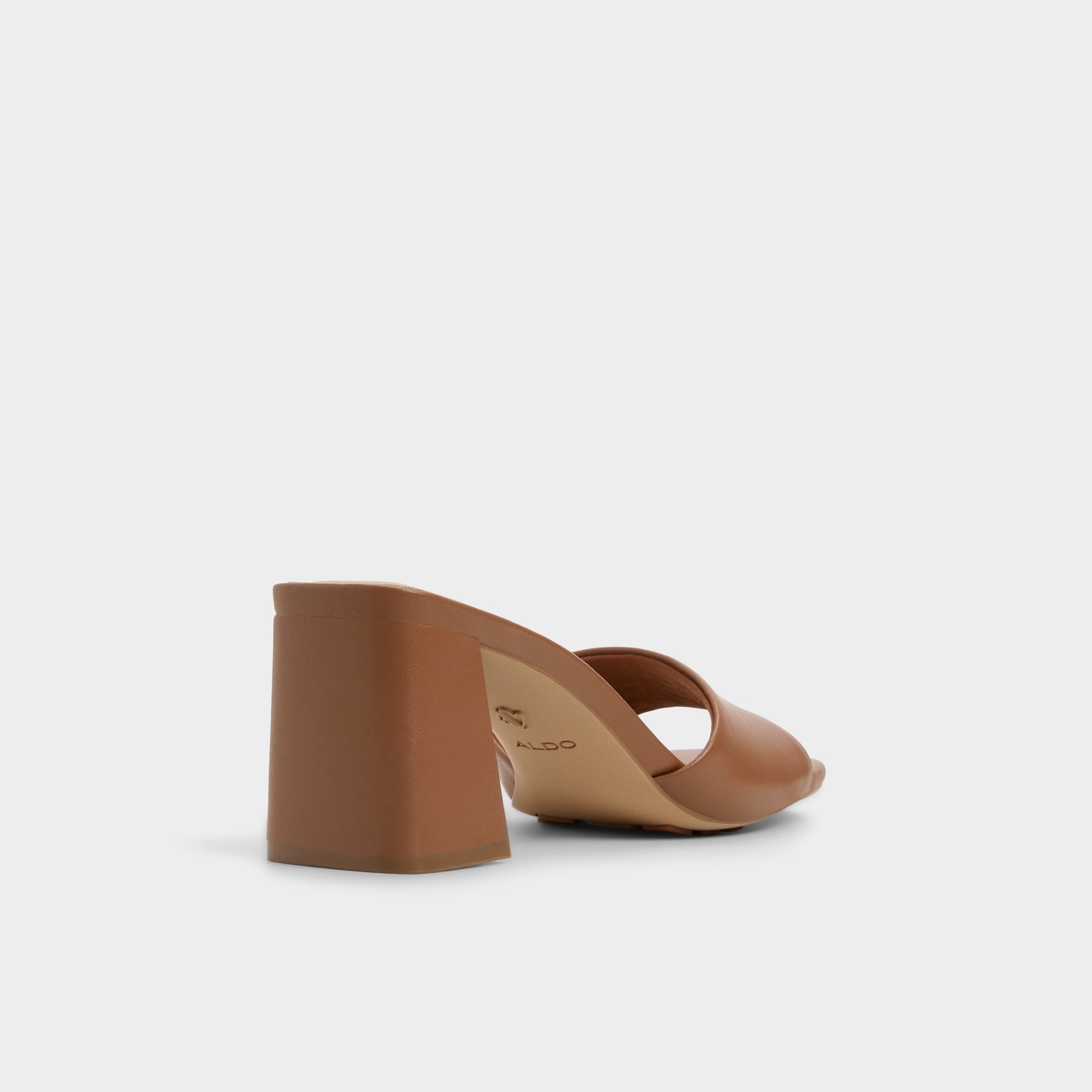 Three-quarter angle of Tan Tisha Heeled mule's back side