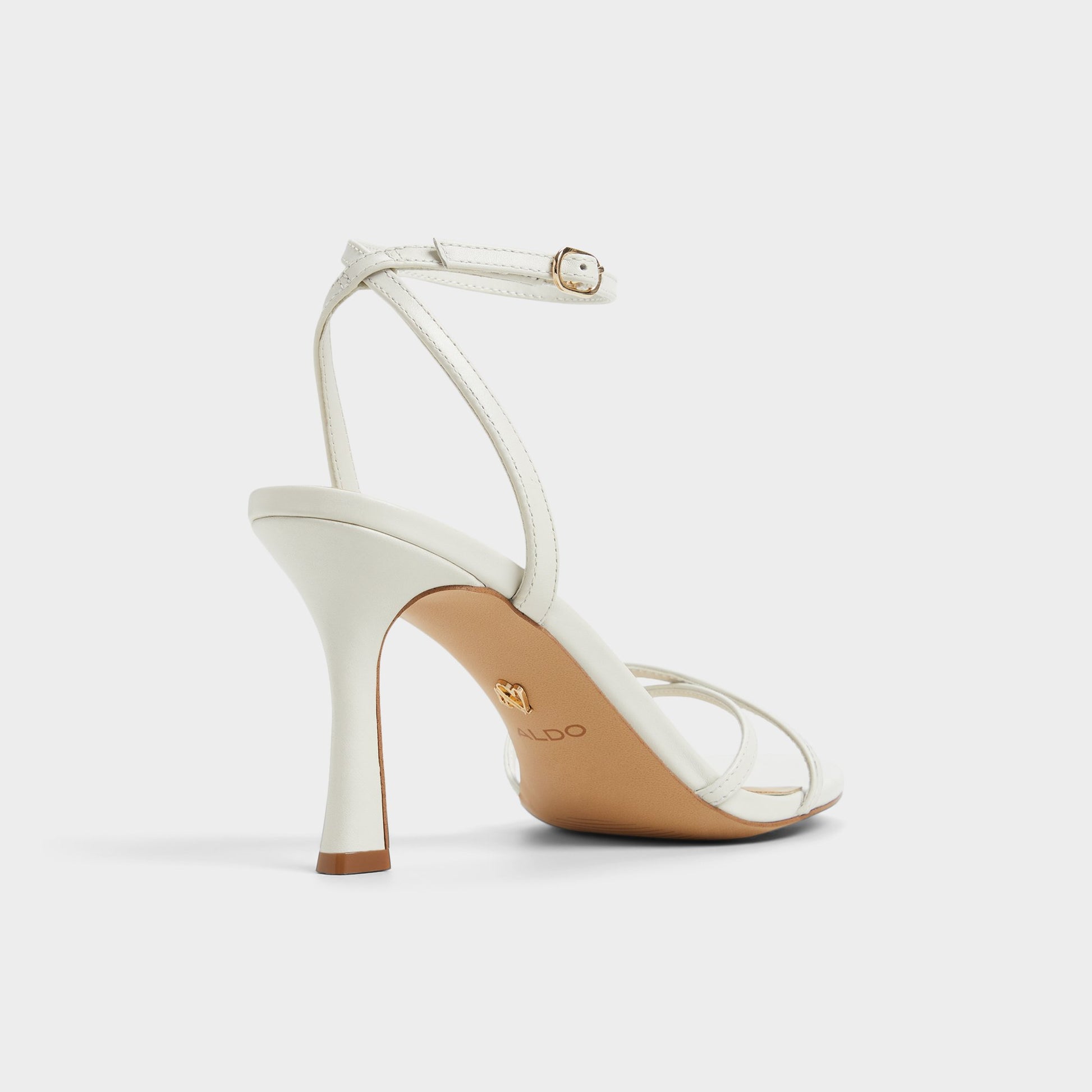 Three-quarter angle of White/Bone Marbela Strappy heeled sandal's back side