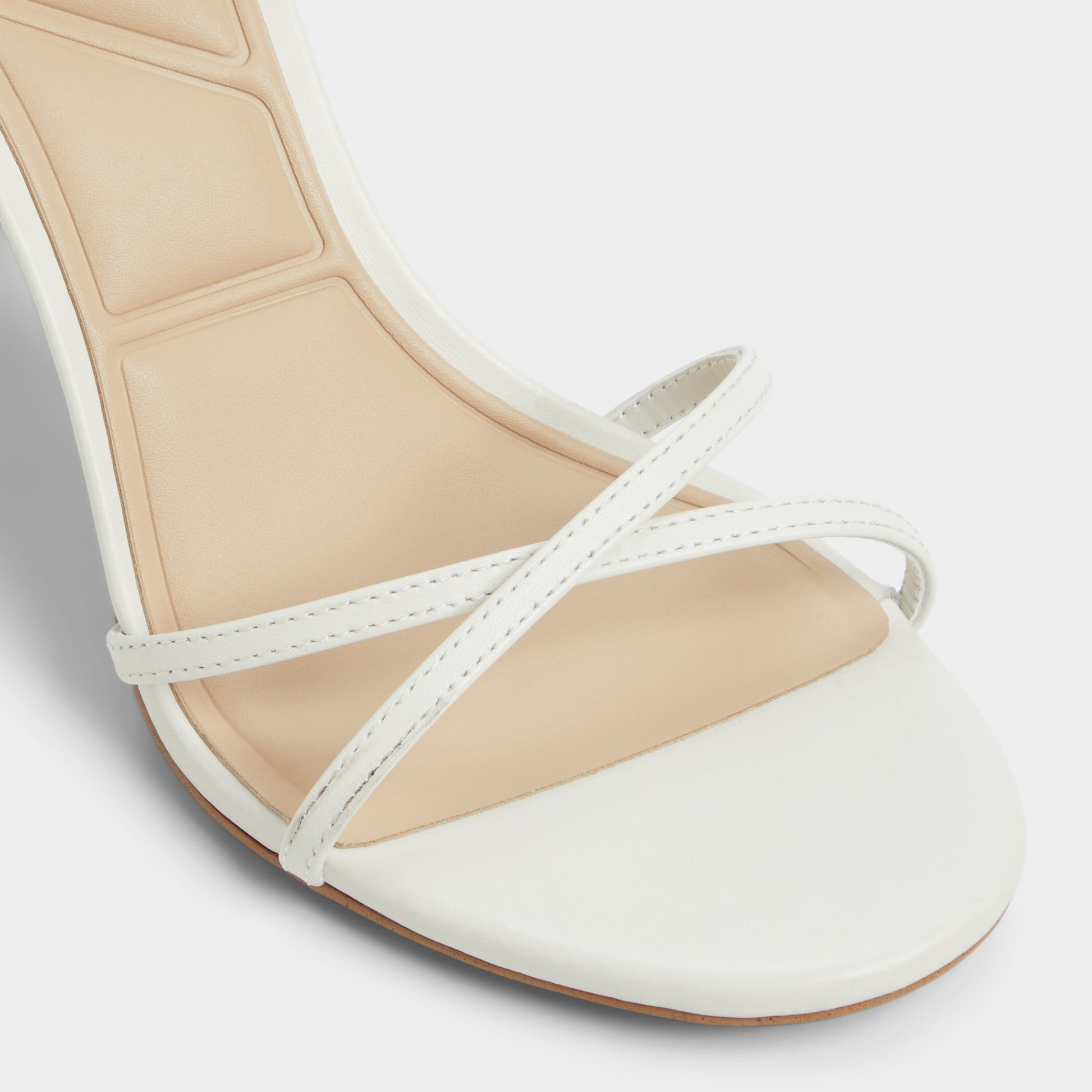 Close-up of the White/Bone Marbela Strappy heeled sandal